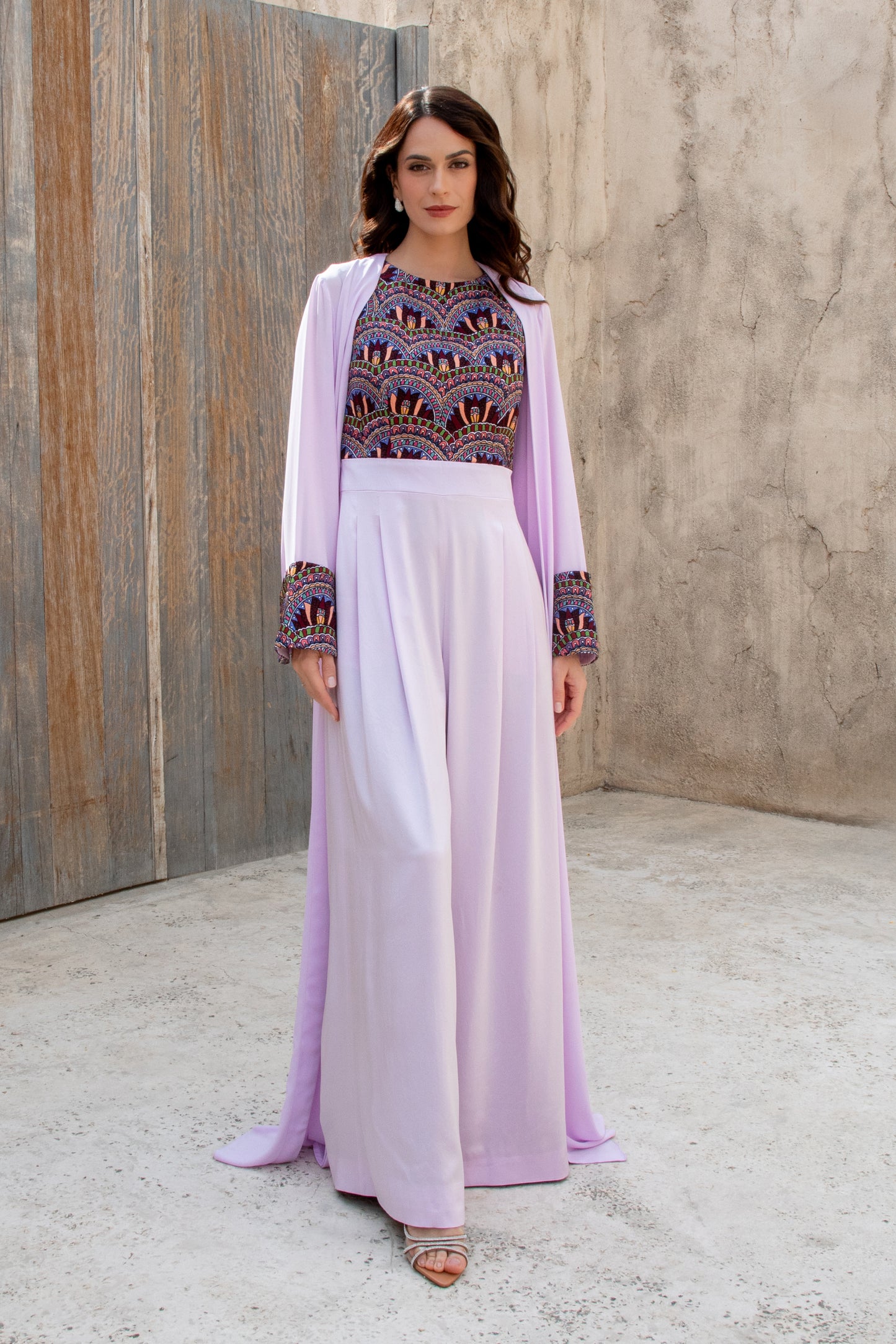 Model in Amethyst Haze jumpsuit with embroidered bodice and sheer jacket