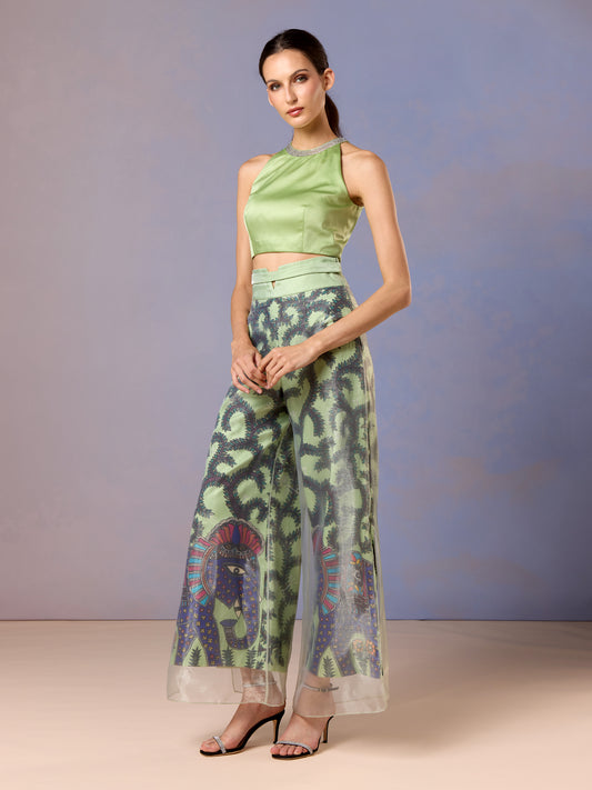 Women in Sage Whisper green sleeveless top and printed trousers