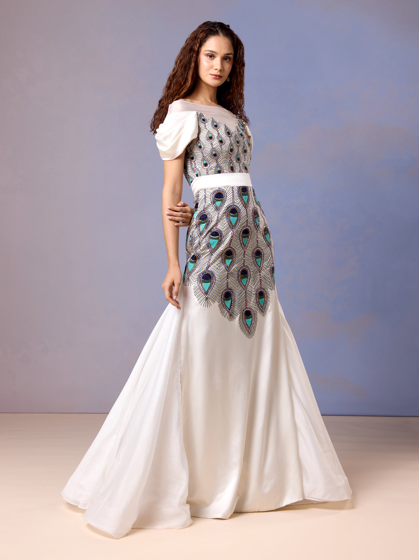 Women wearing Chantilly white silk satin gown with peacock motif front embroidery