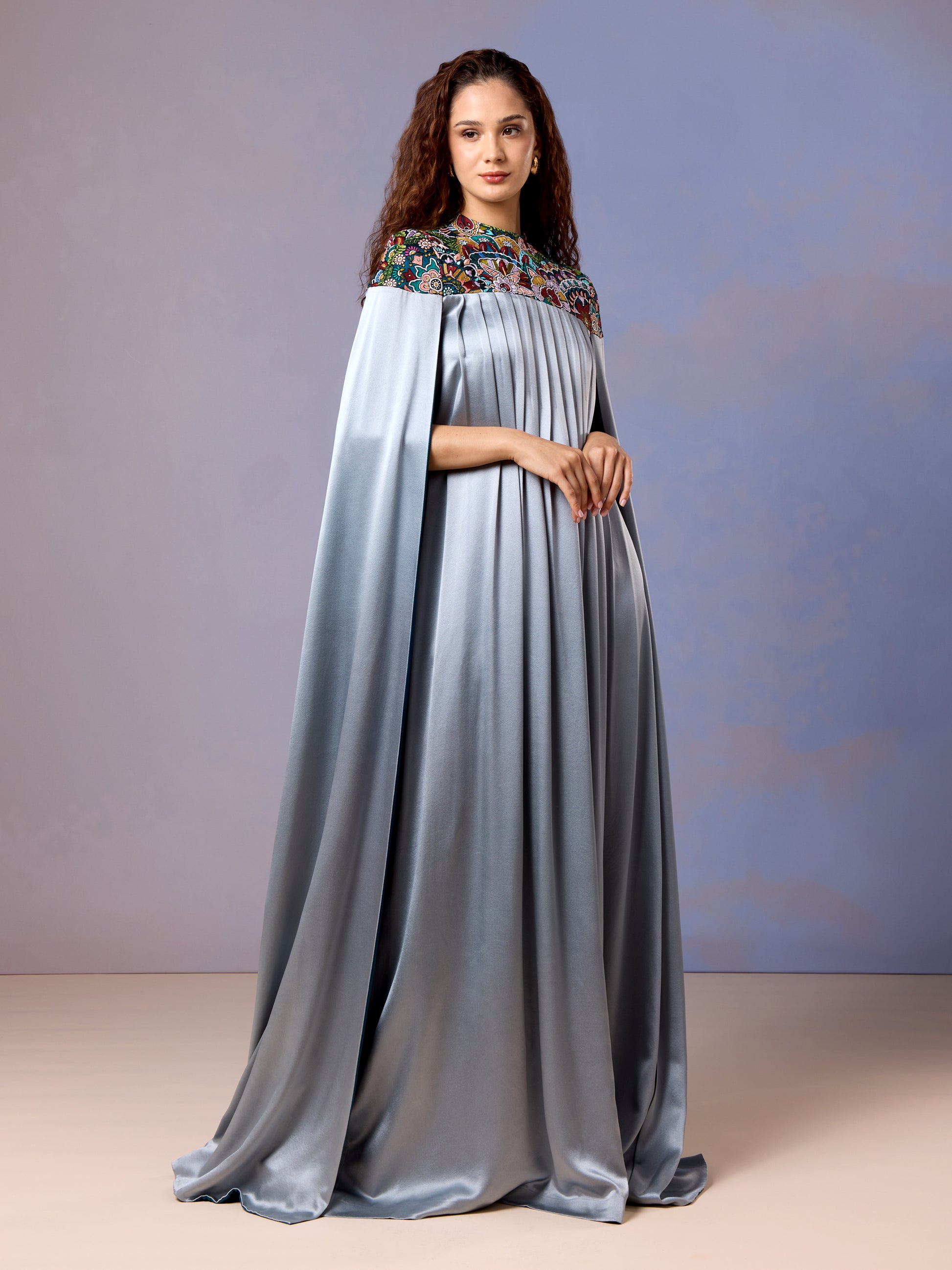 Front view of glacier blue silk kaftan with embroidered neckline