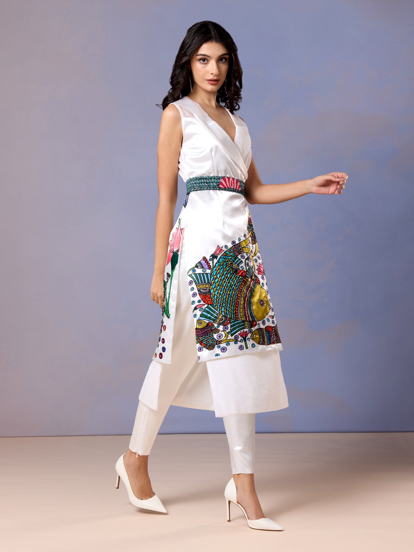Side pose of model in Chantilly white kurti with embroidered design and pants