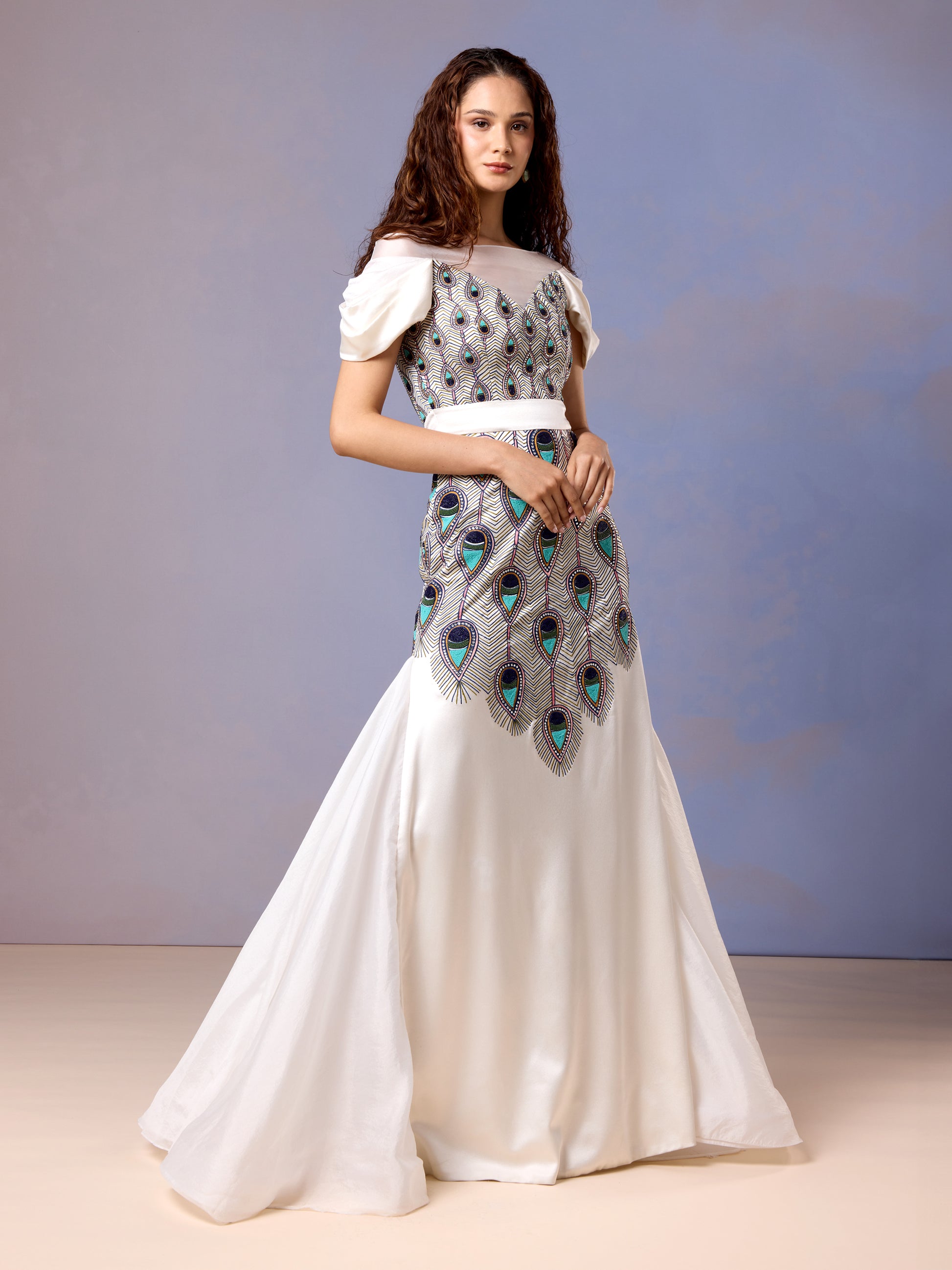 Front view of Chantilly white satin gown featuring peacock-inspired embroidery