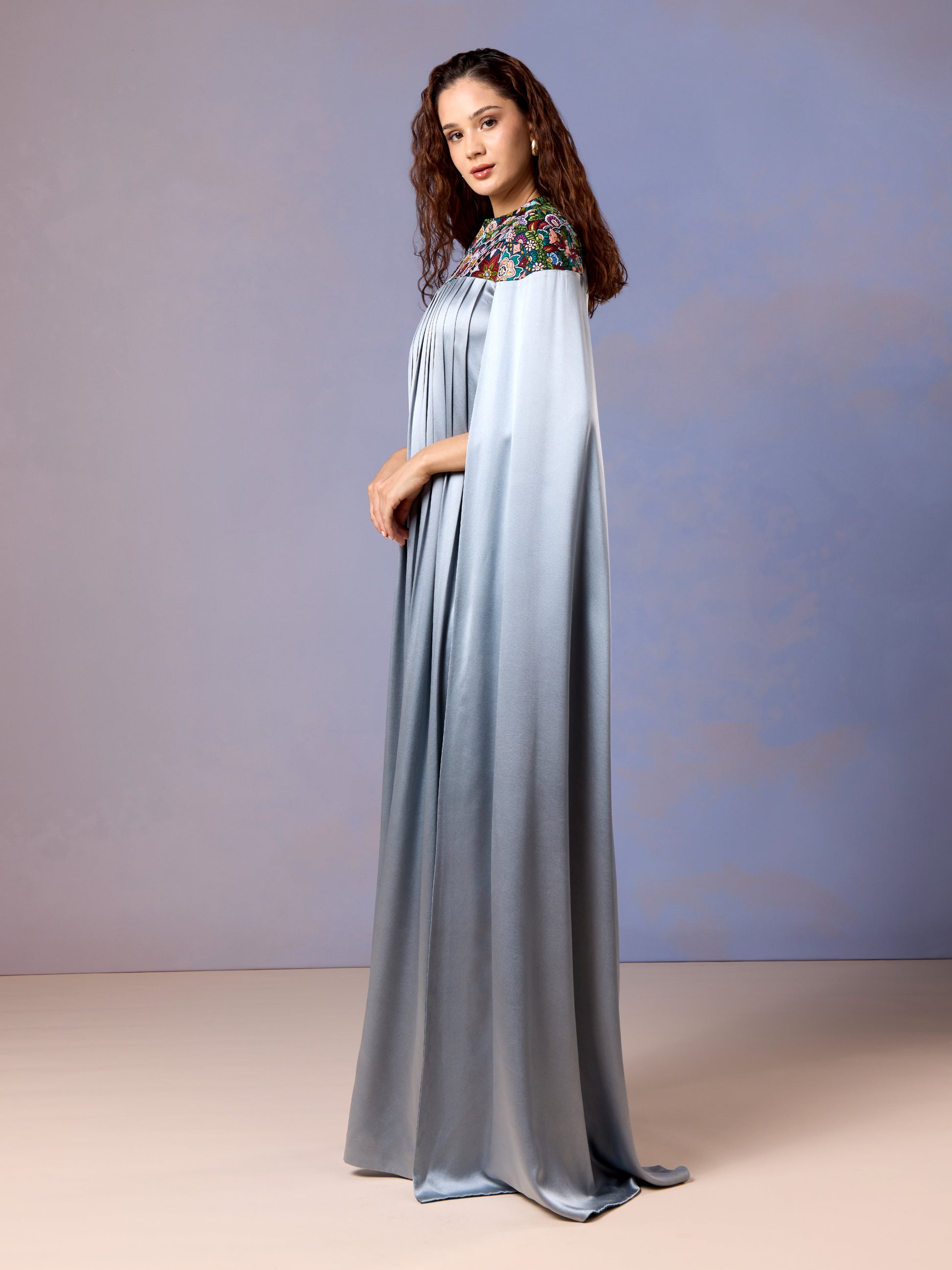 Side view of floor-length glacier blue kaftan in satin finish