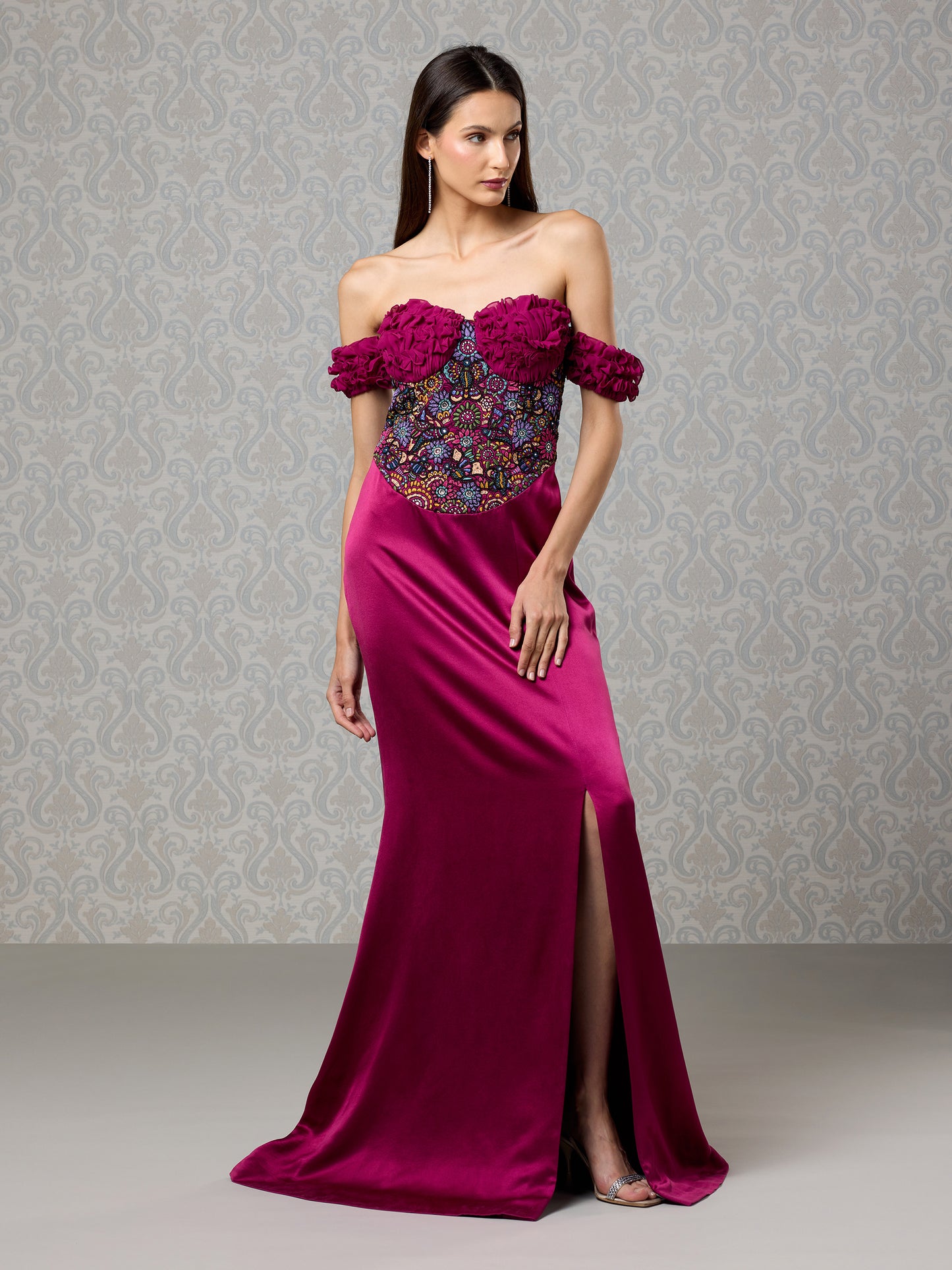 Full-length side view of off-shoulder cranberry satin gown with embellished bodice