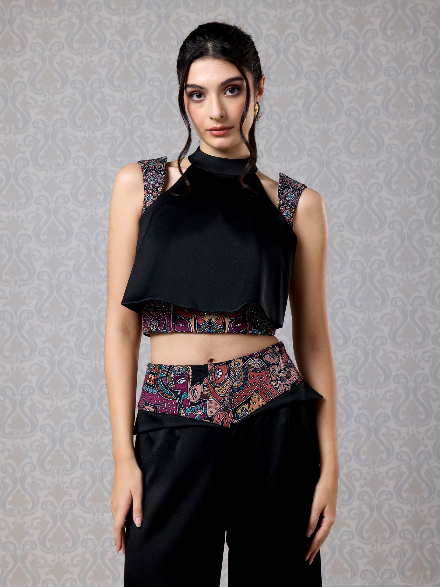 Front view of black satin top with contrast printed corset