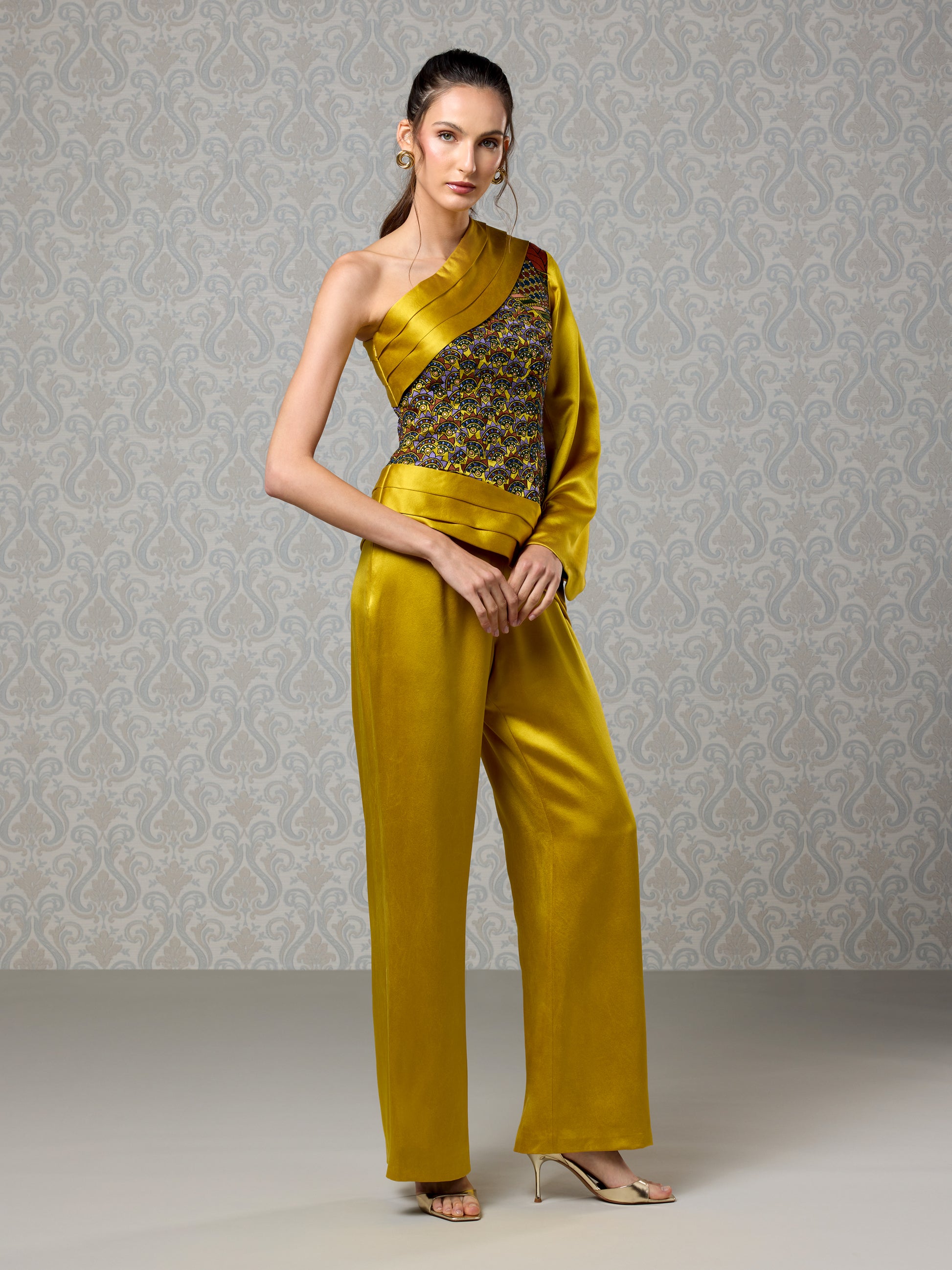 Harvest gold one-shoulder jumpsuit with detailed embroidery and straight pants