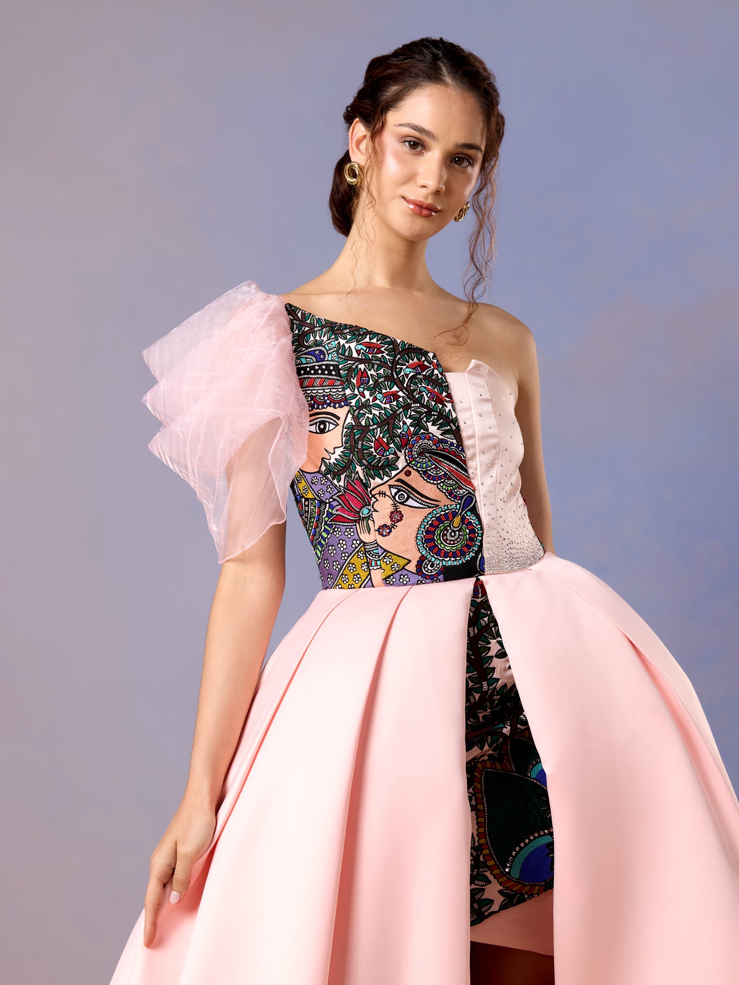 Side view of coral blush gown featuring puff sleeve and floral embroidery