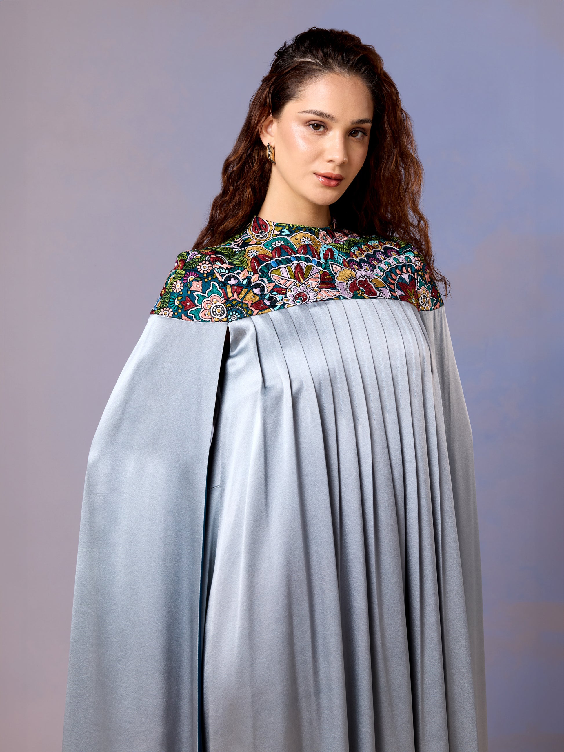 Close-up of floral embroidery on glacier blue kaftan neckline
