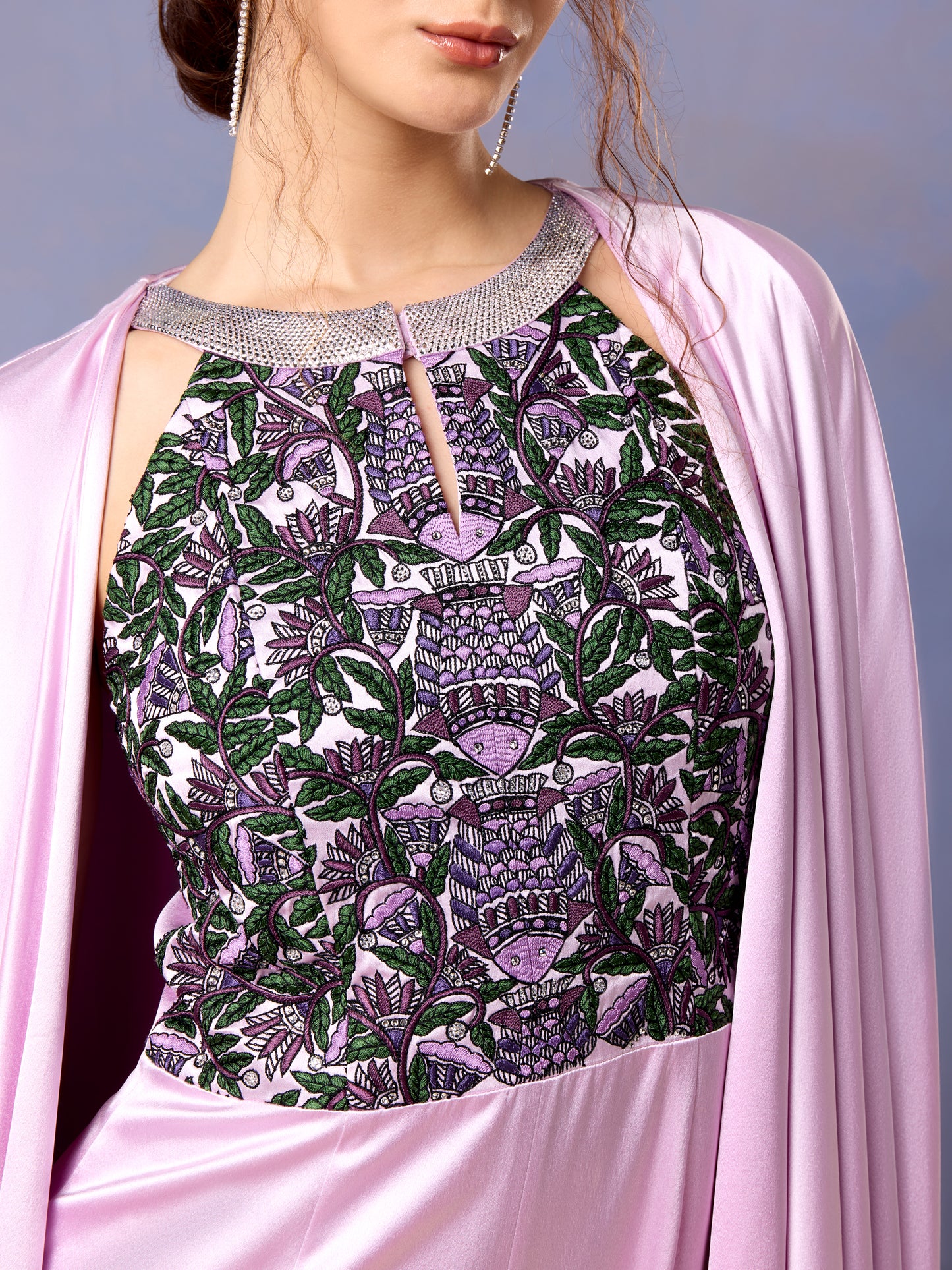 Close-up of floral embroidery on French lilac jumpsuit bodice