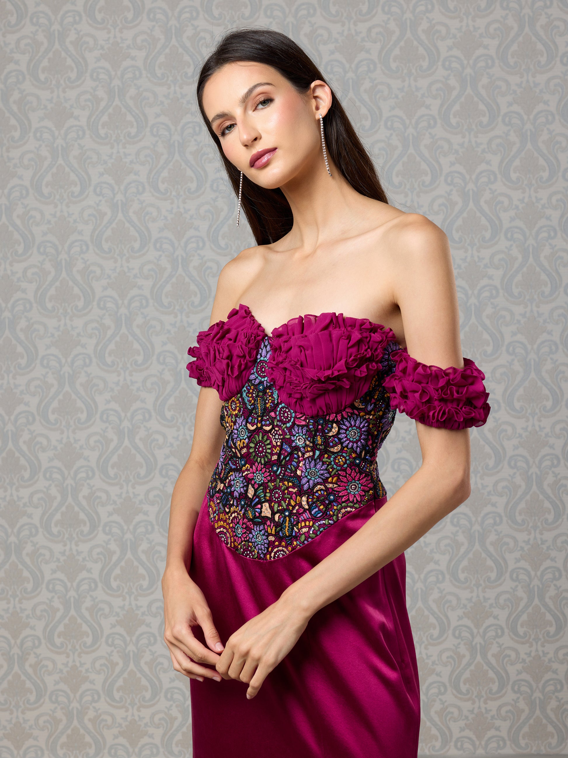 Close-up of embroidered georgette bodice and rose-detailed sleeves on satin gown