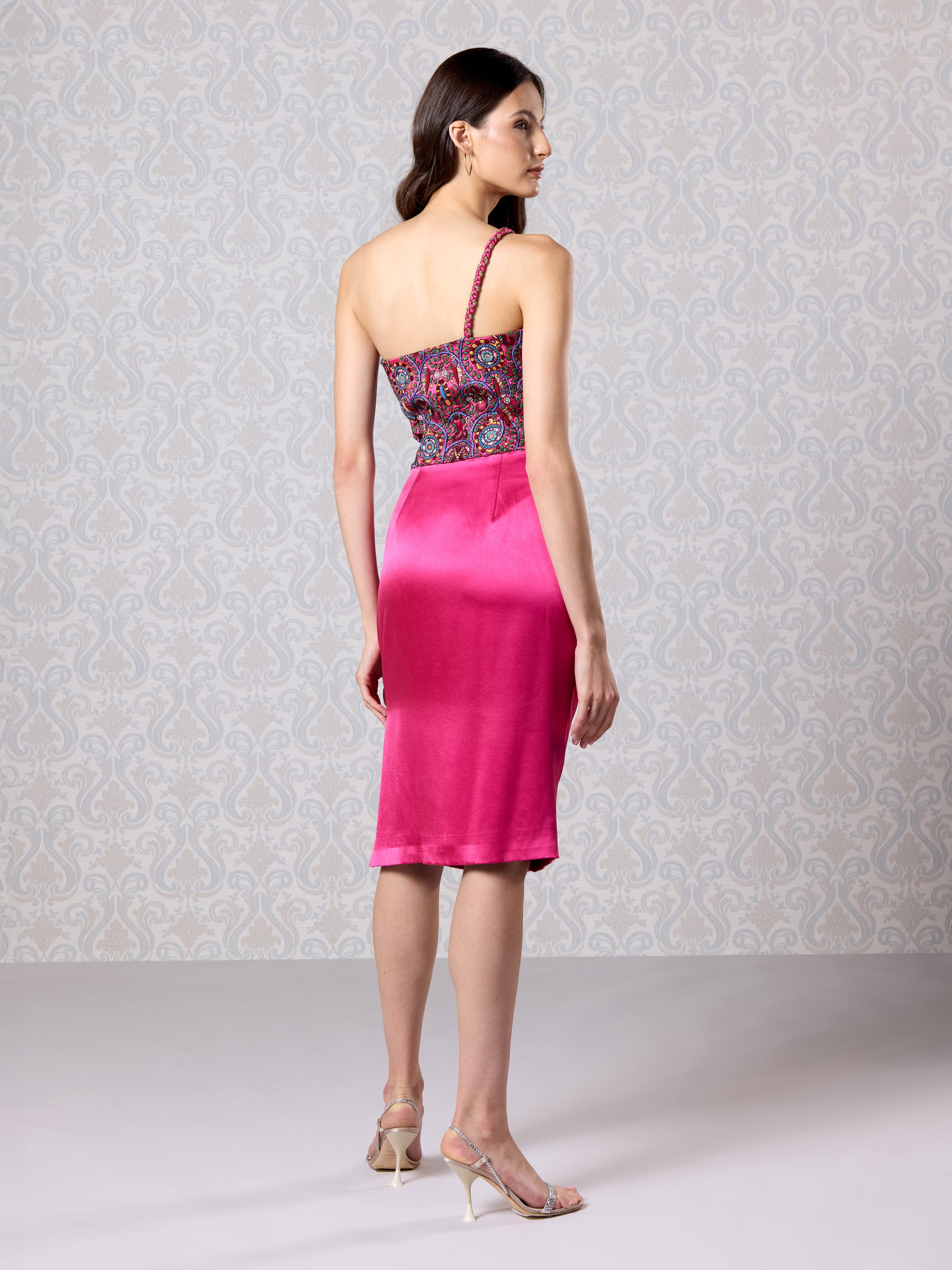 Angled side view of merlot satin midi dress with elegant silhouette