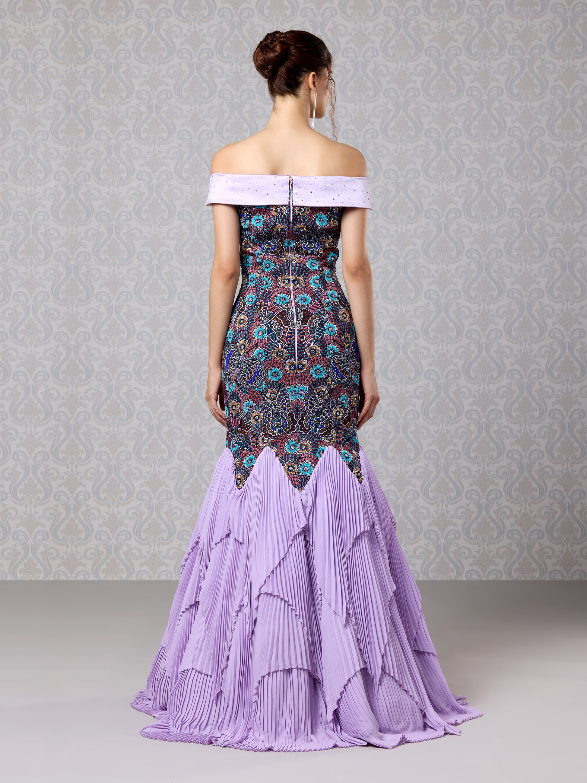 Back view of Amethyst Haze gown with fitted embroidery and layered lilac flared hem