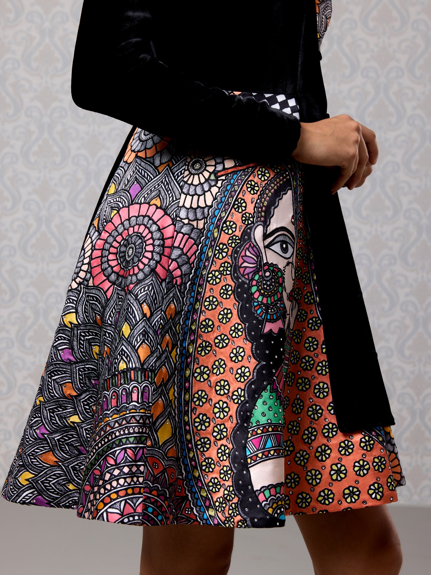 Detailed view of moonlight blue printed skirt on Black Ice asymmetric short dress