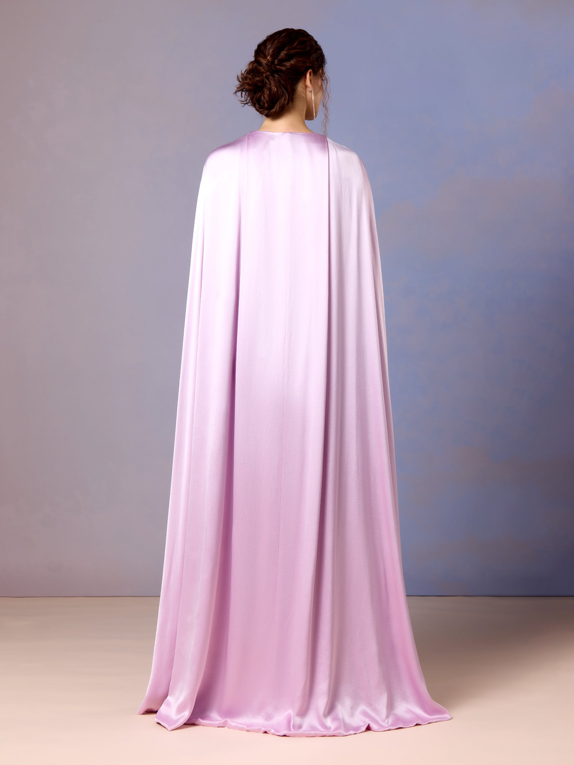 Back view of flowing cape on French lilac embroidered jumpsuit