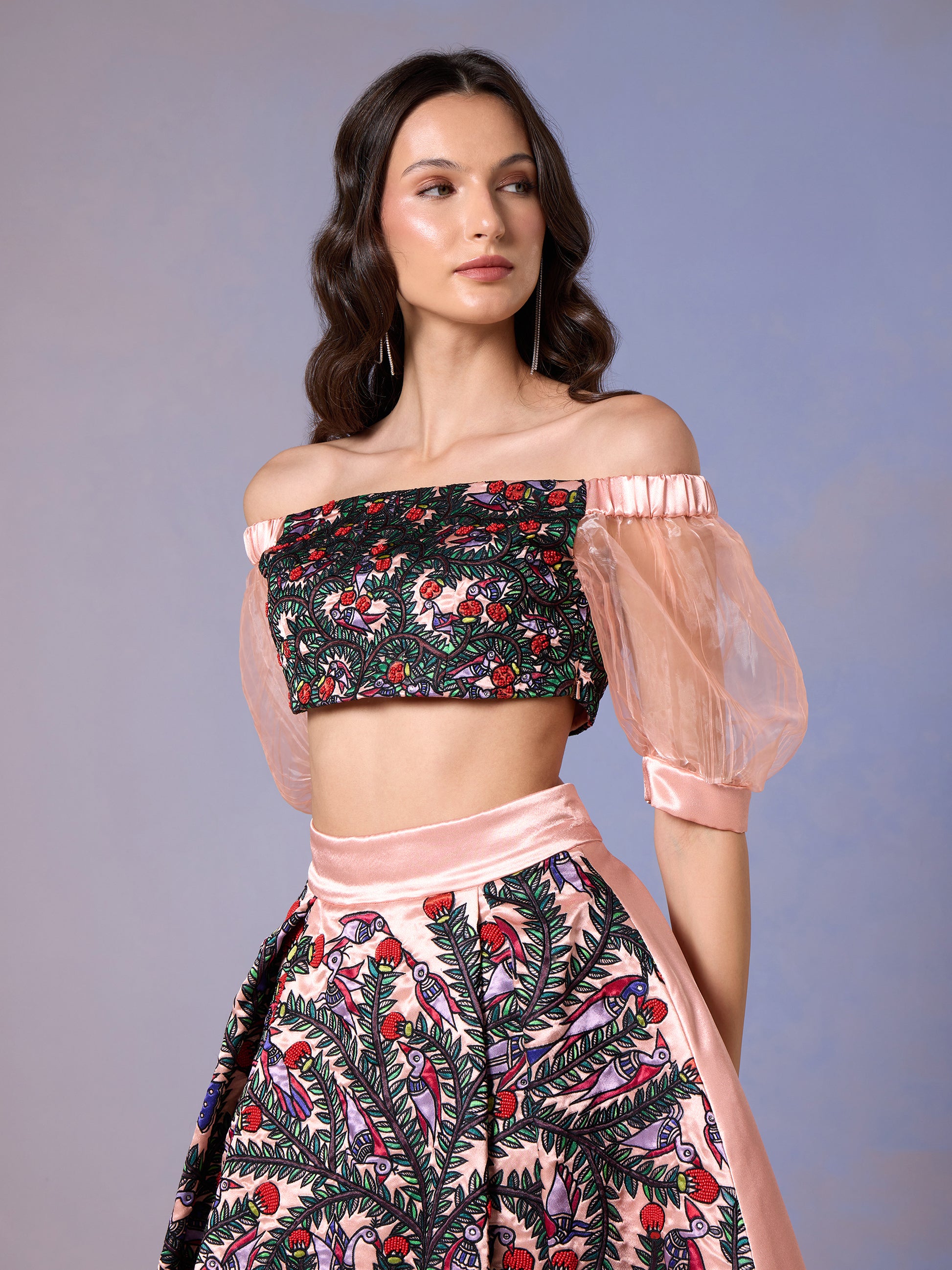 Model wearing Coral Blush top and floral printed skirt set