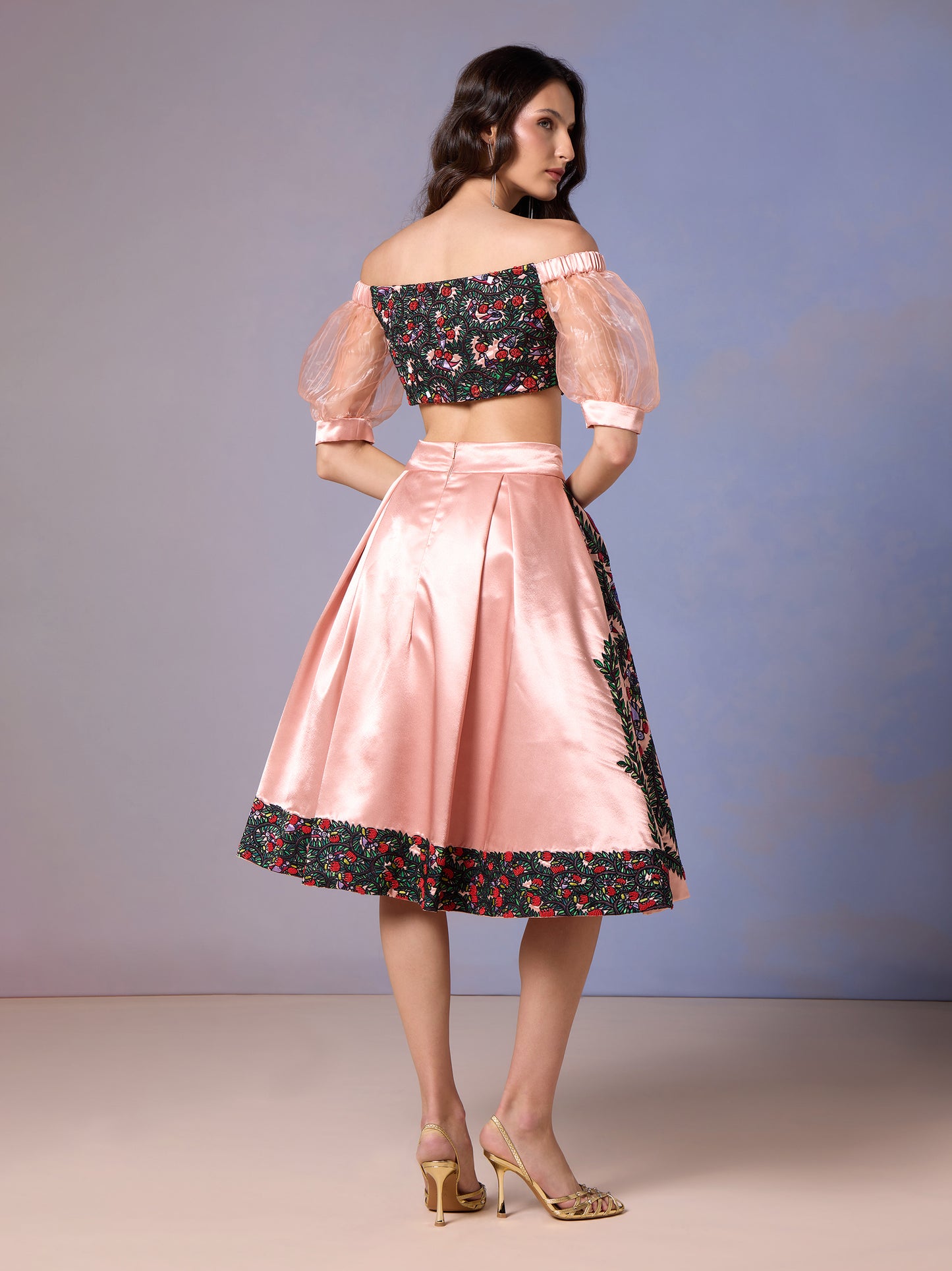 Side pose in Coral Blush printed skirt and pink mesh sleeve top