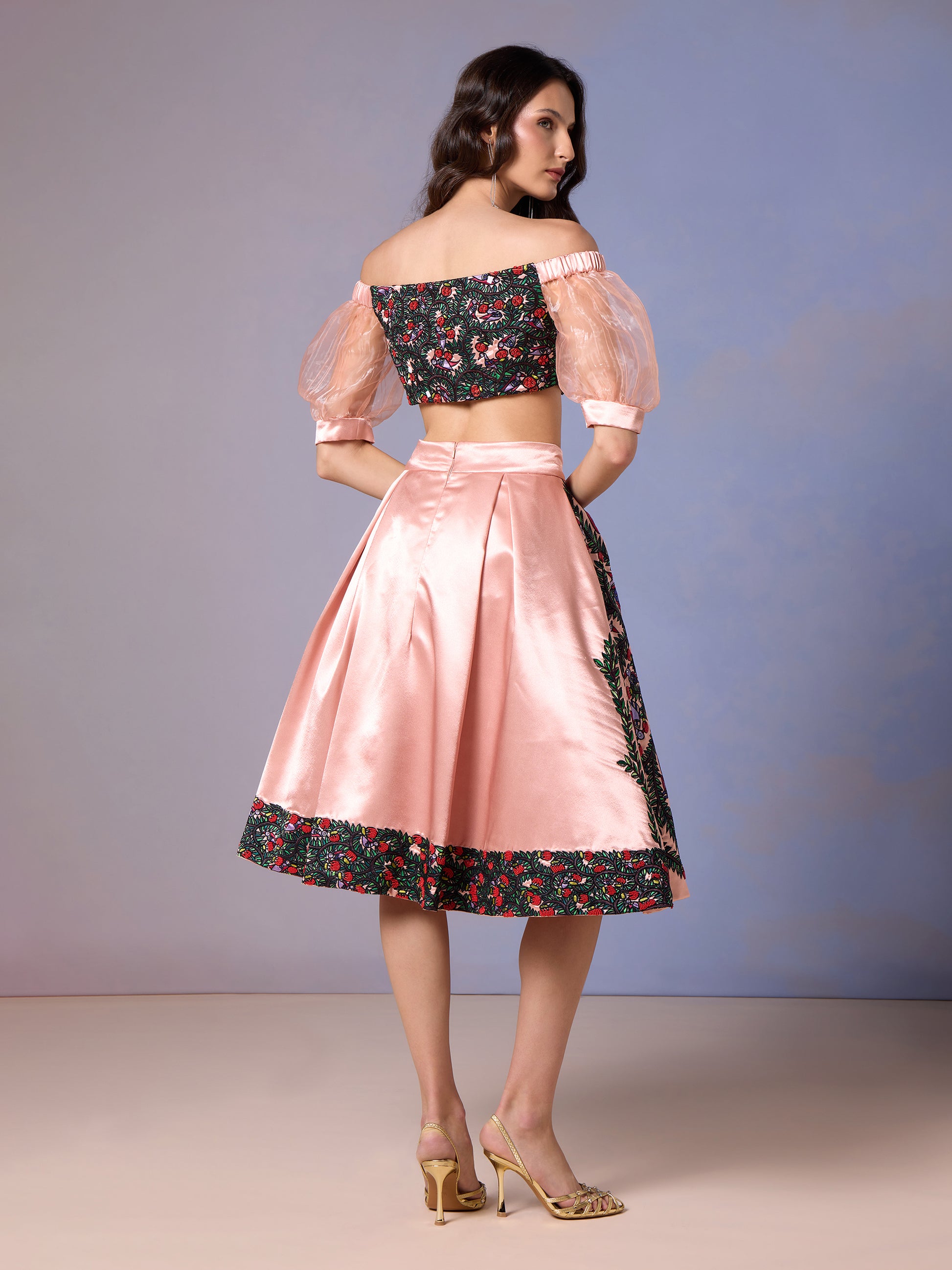 Side pose in Coral Blush printed skirt and pink mesh sleeve top