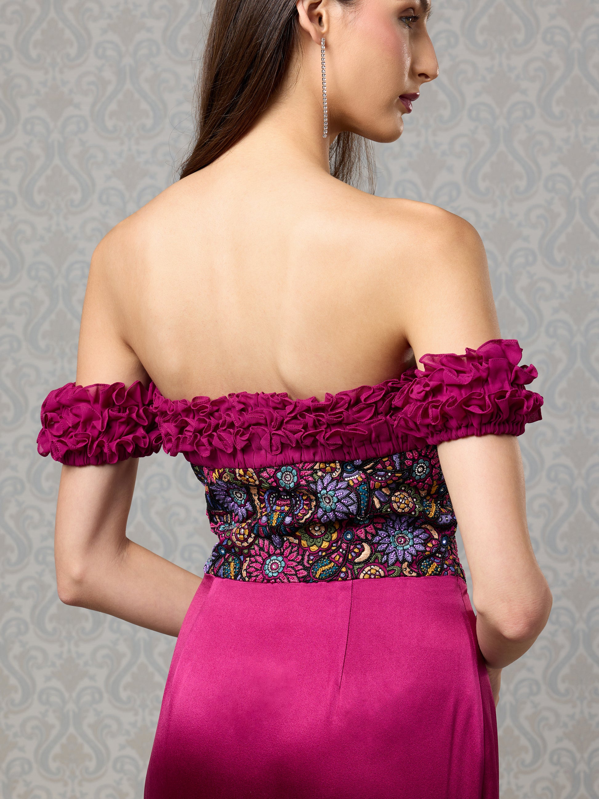 Detailed back close-up of floral georgette sleeves and fitted satin bodice