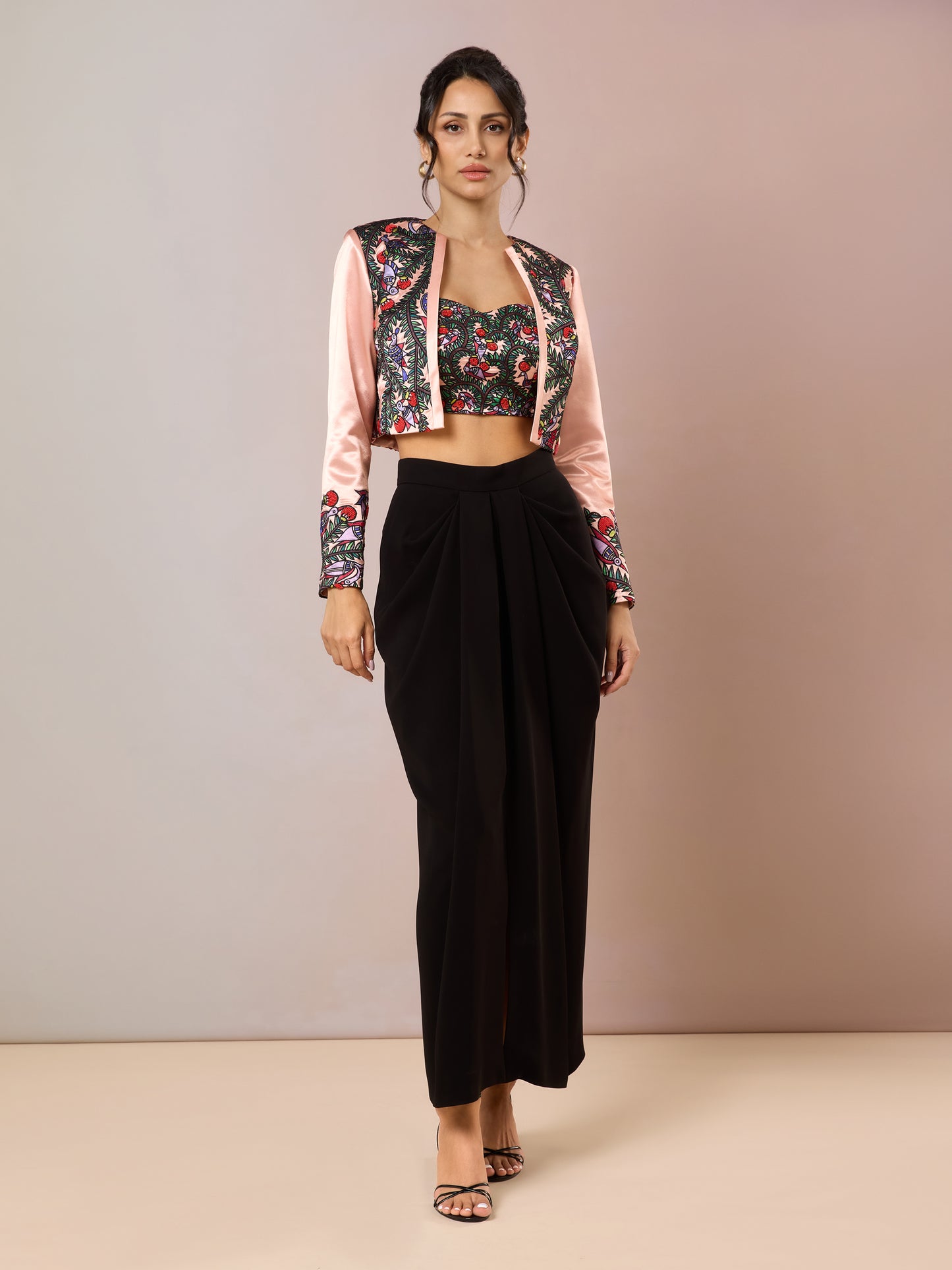 Model in floral embroidered crop jacket with black high-waist pants