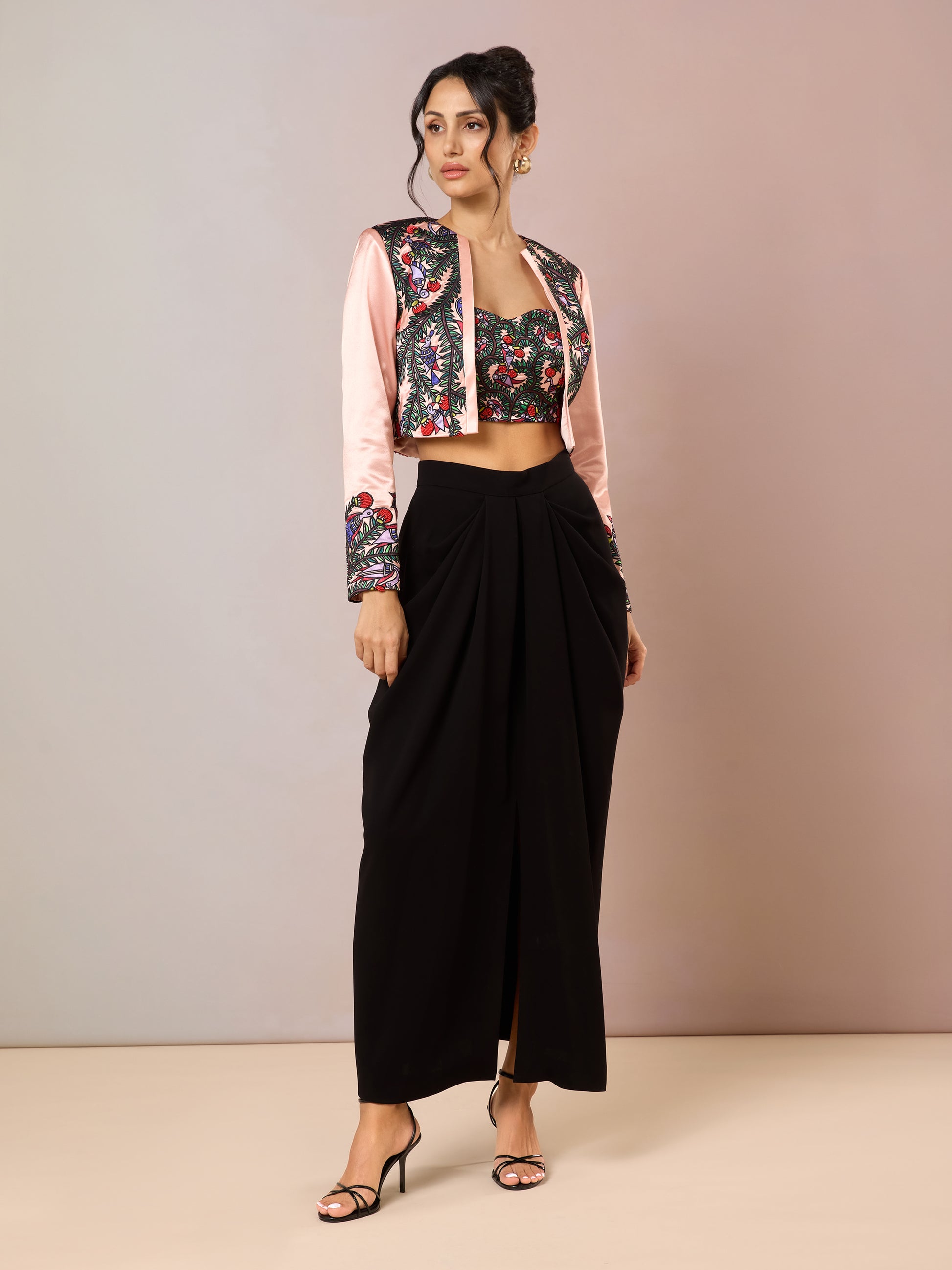 Front-side view of floral crop jacket paired with black pants