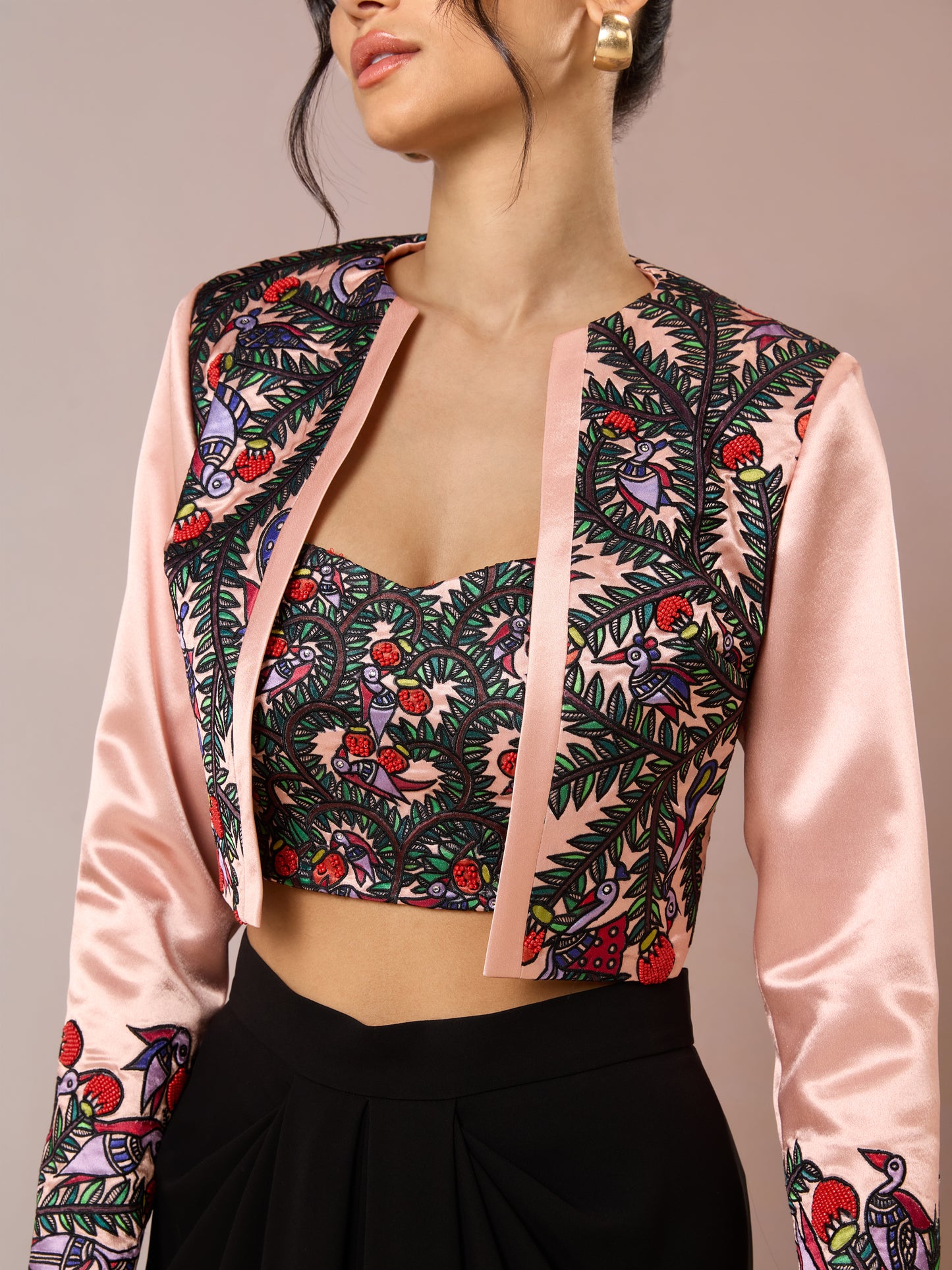 Close-up of floral embroidered bustier with satin jacket detail