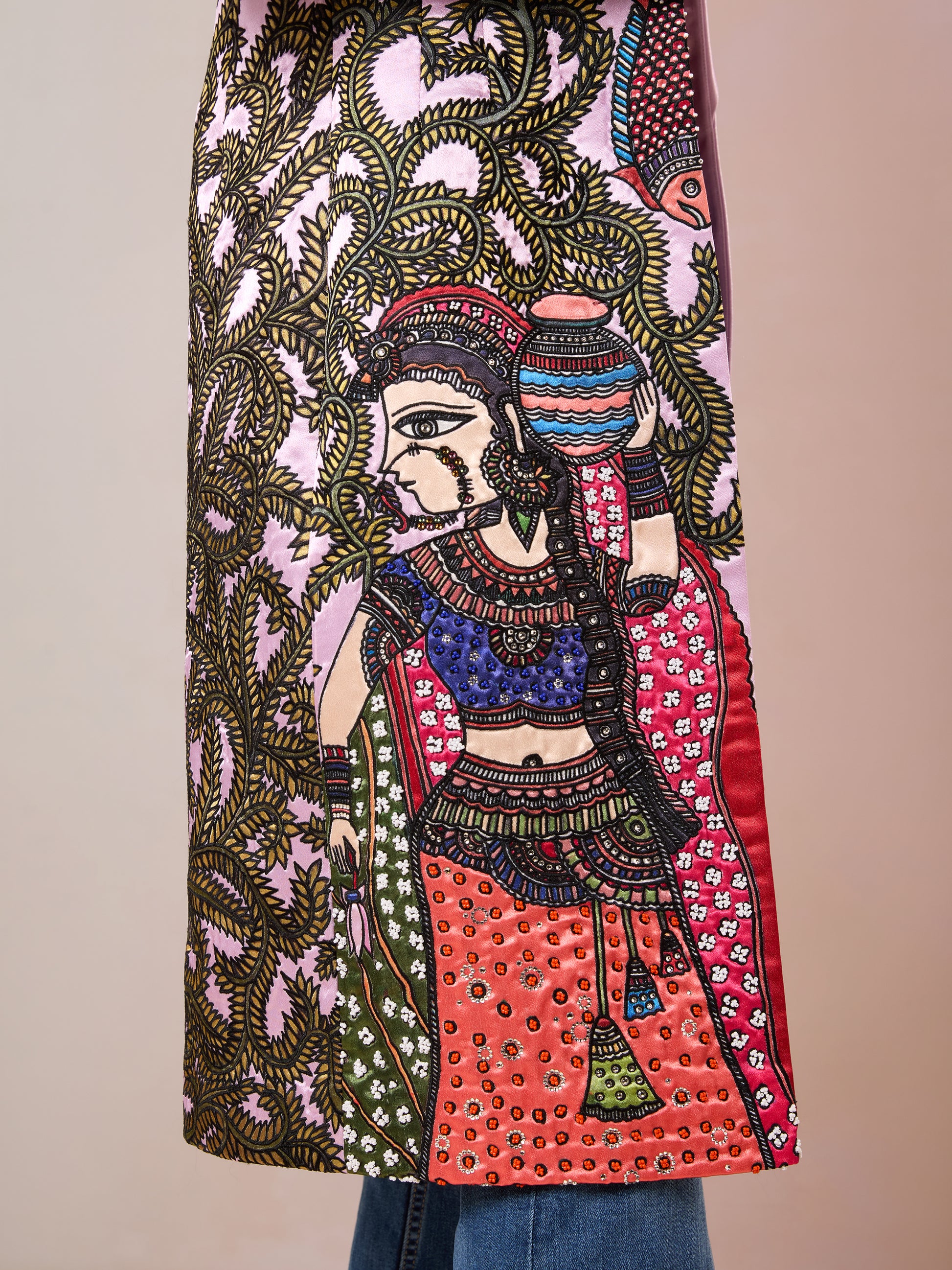 Zoom-in of traditional Madhubani print on pink jacket