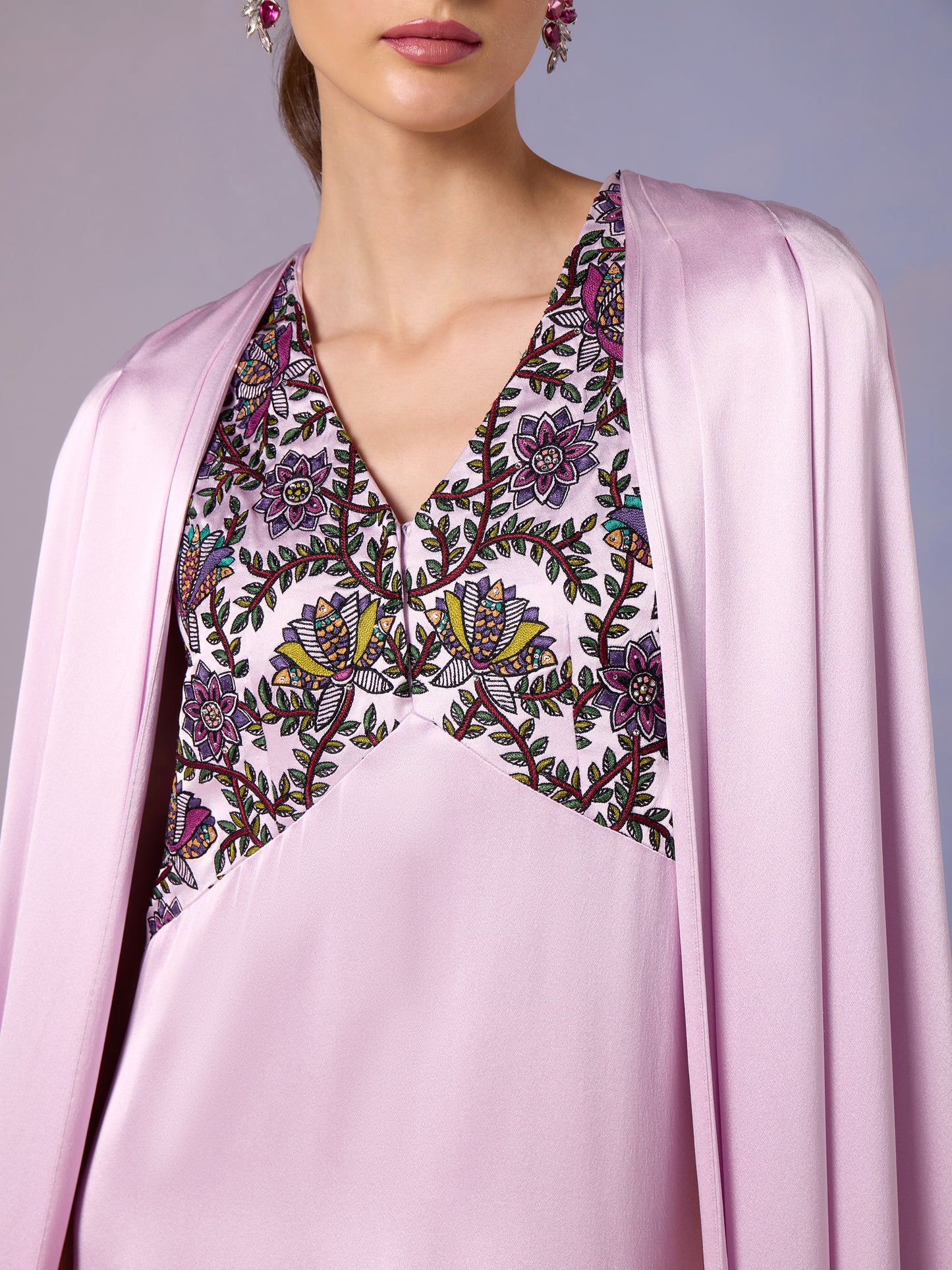 Close-up of French Lilac kaftan's intricate embroidered neckline