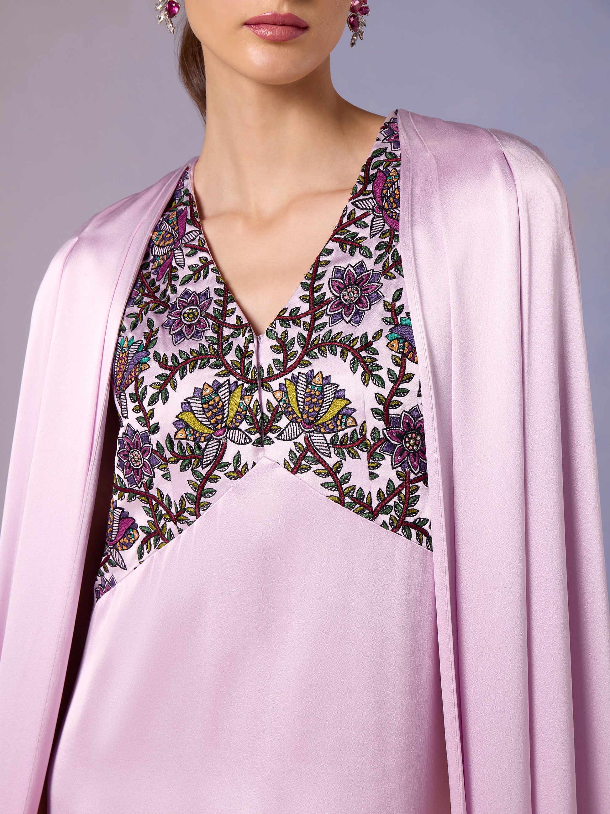 Close-up of French Lilac kaftan's intricate embroidered neckline