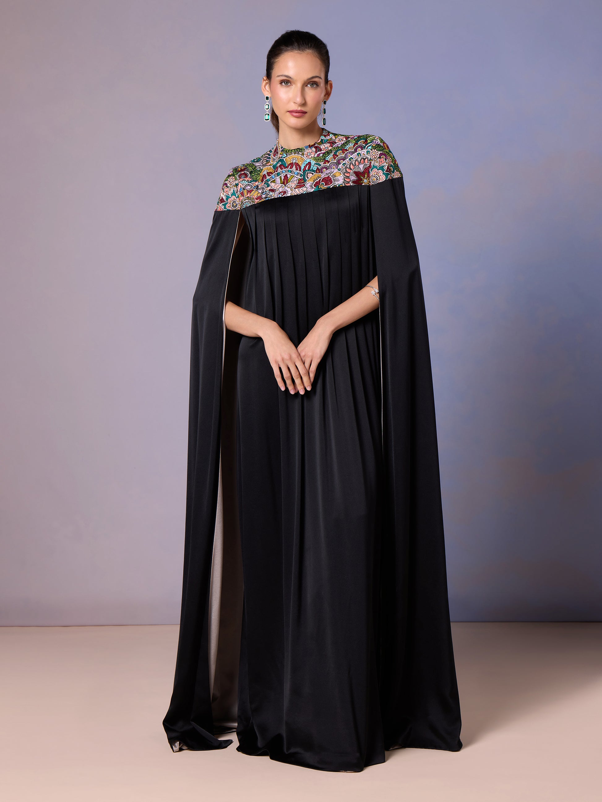 Model in Midnight Black silk kaftan with colorful embroidered yoke