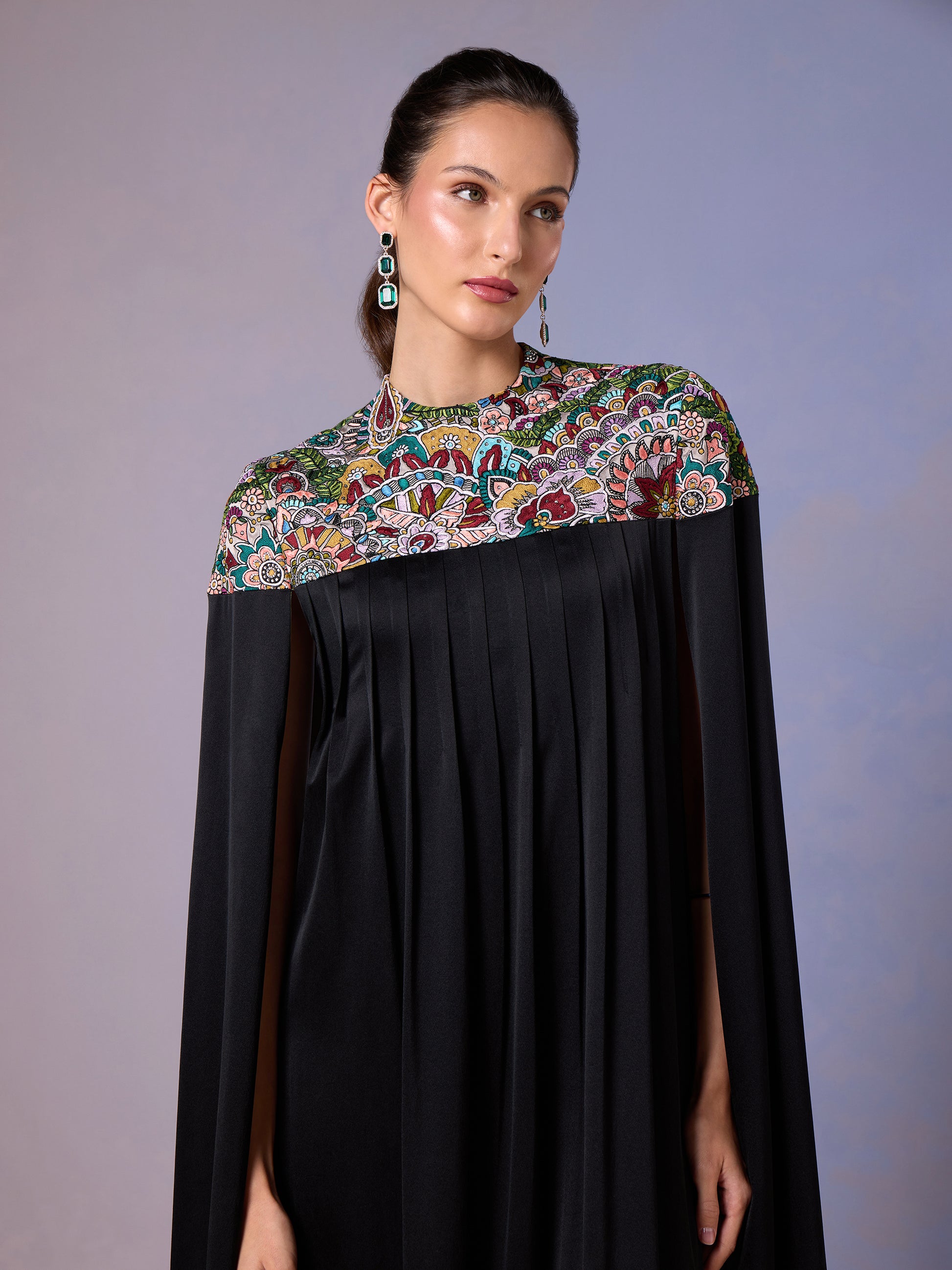 Front view of elegant black silk kaftan with multicolor embroidery