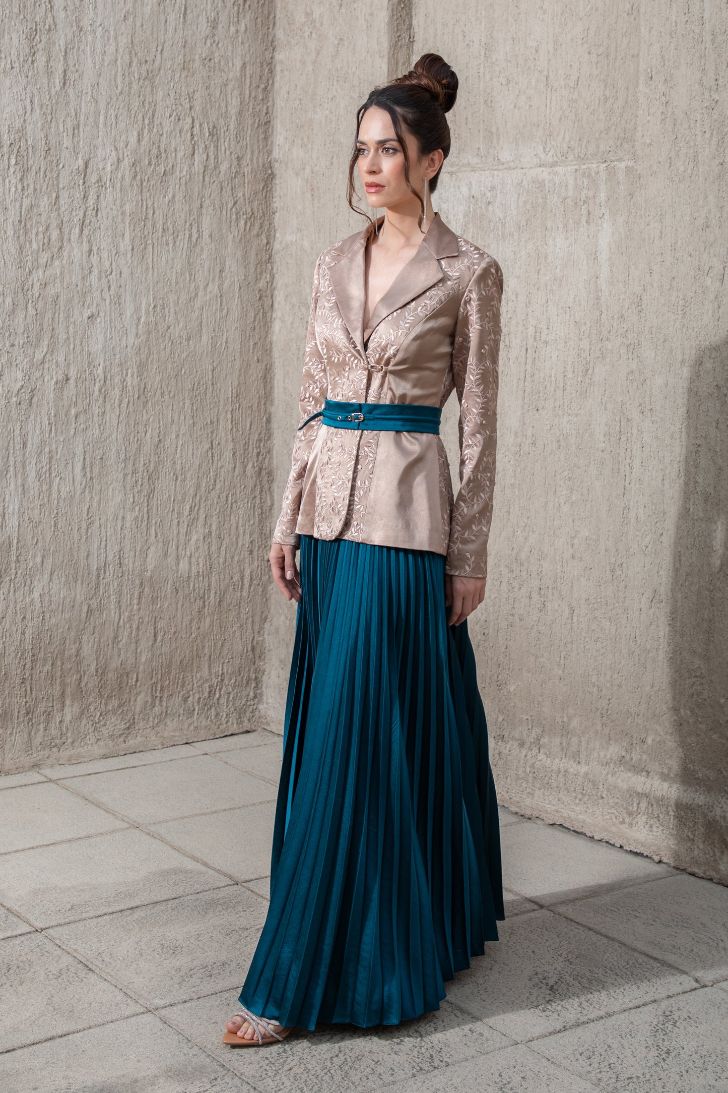 side-view-of-brown -blazer top and pleated-blue-skirt-set