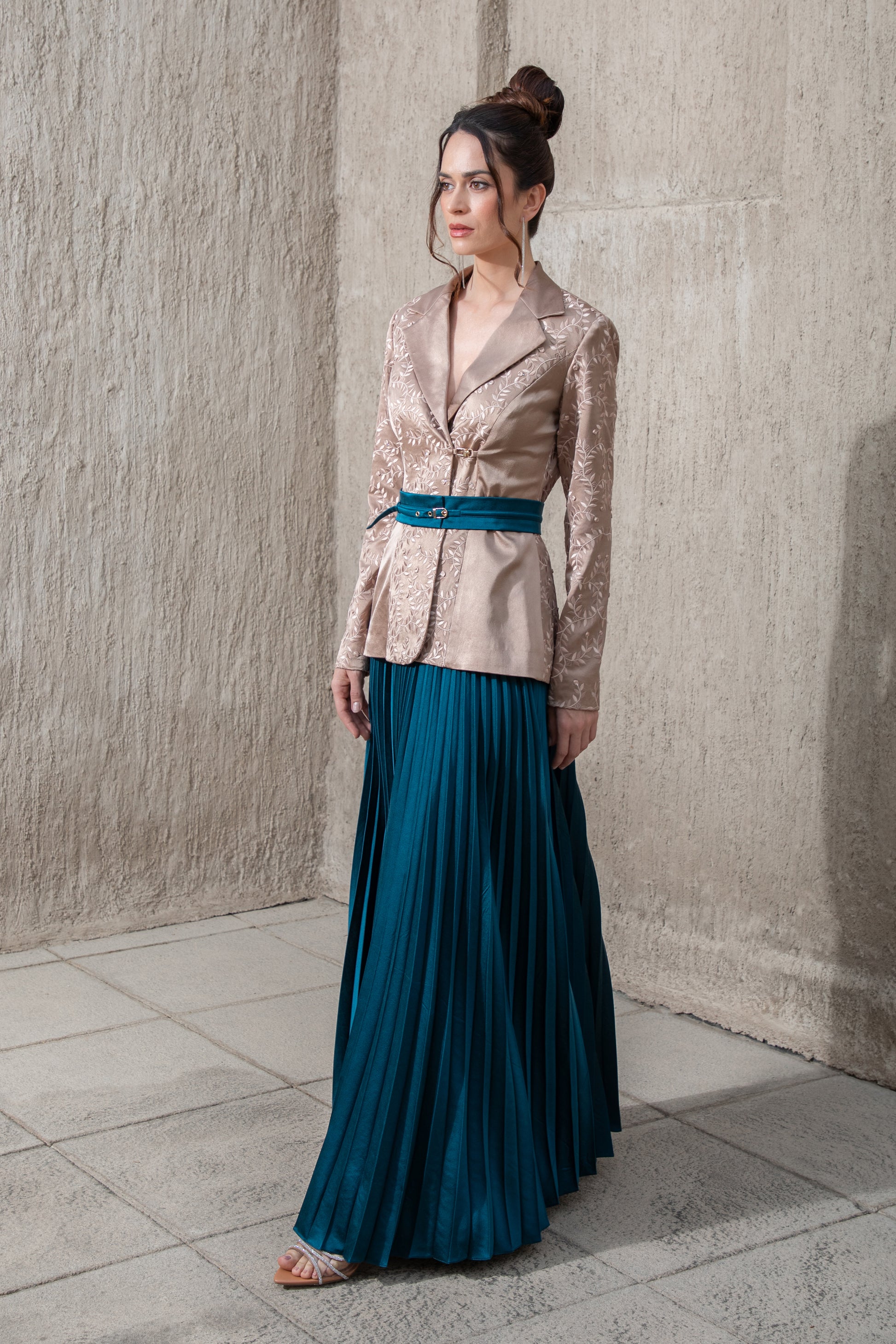 side-view-of-brown -blazer top and pleated-blue-skirt-set