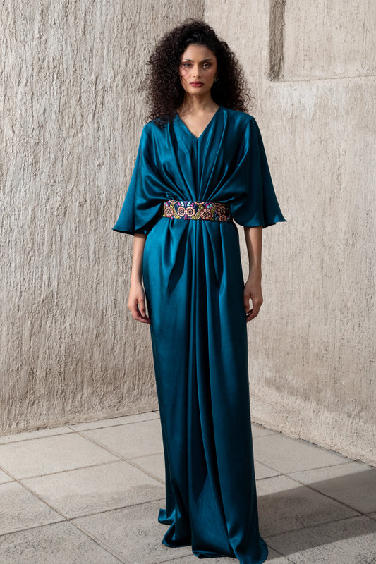 Model wearing moonlight blue evening gown with embellished waist