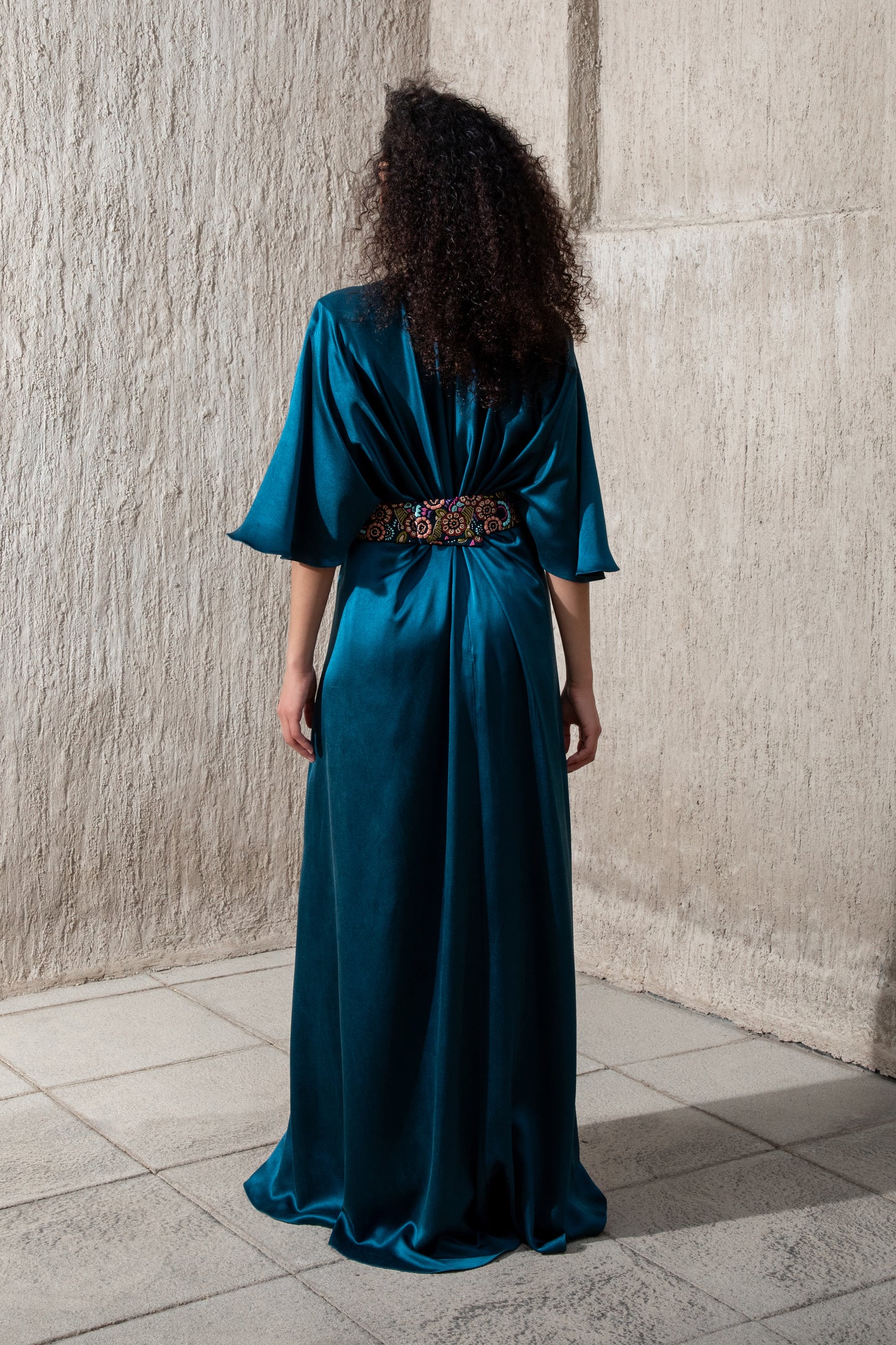 Back view of flowy moonlight blue evening gown