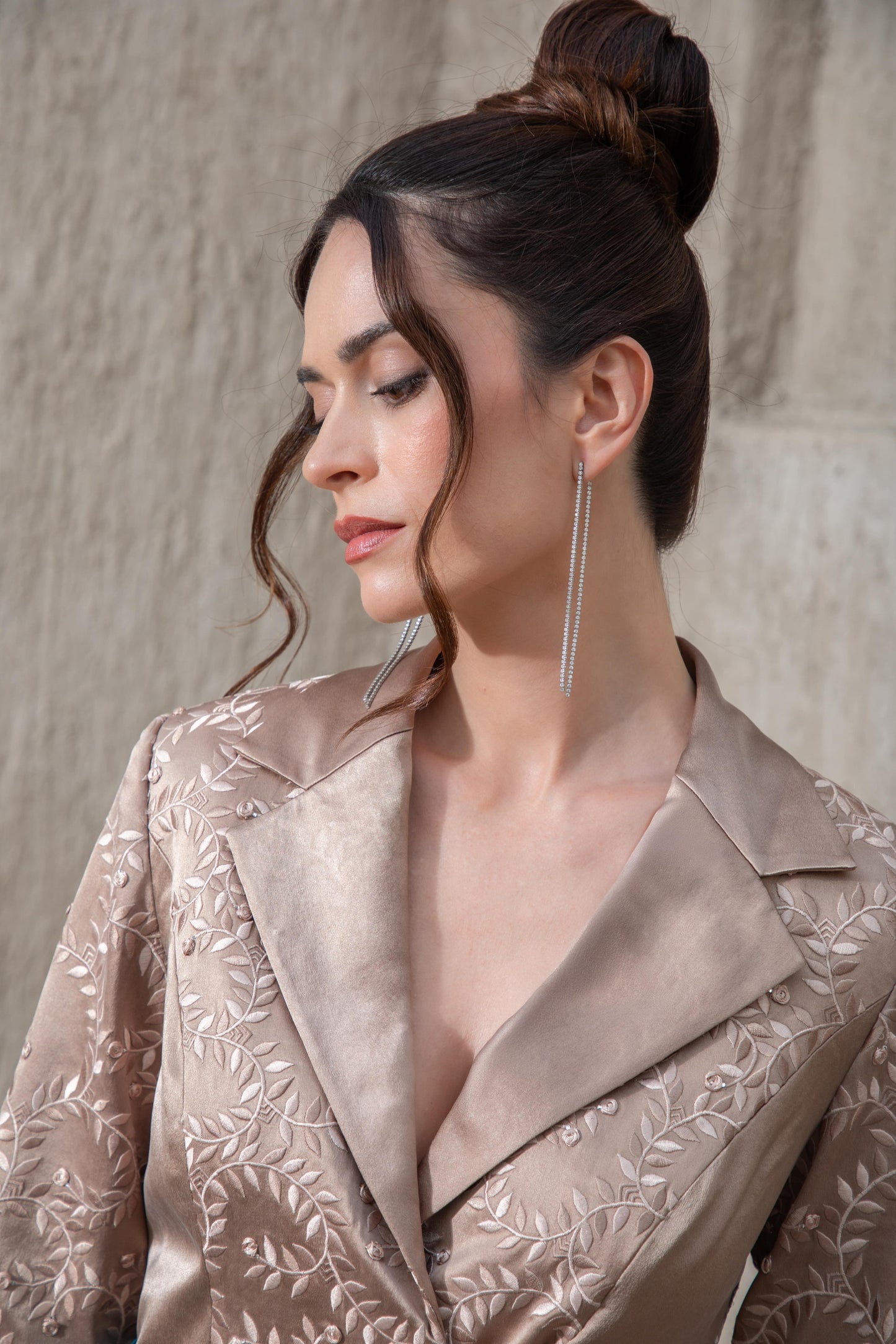 Close-up of brown embroidered top with lapel detailing