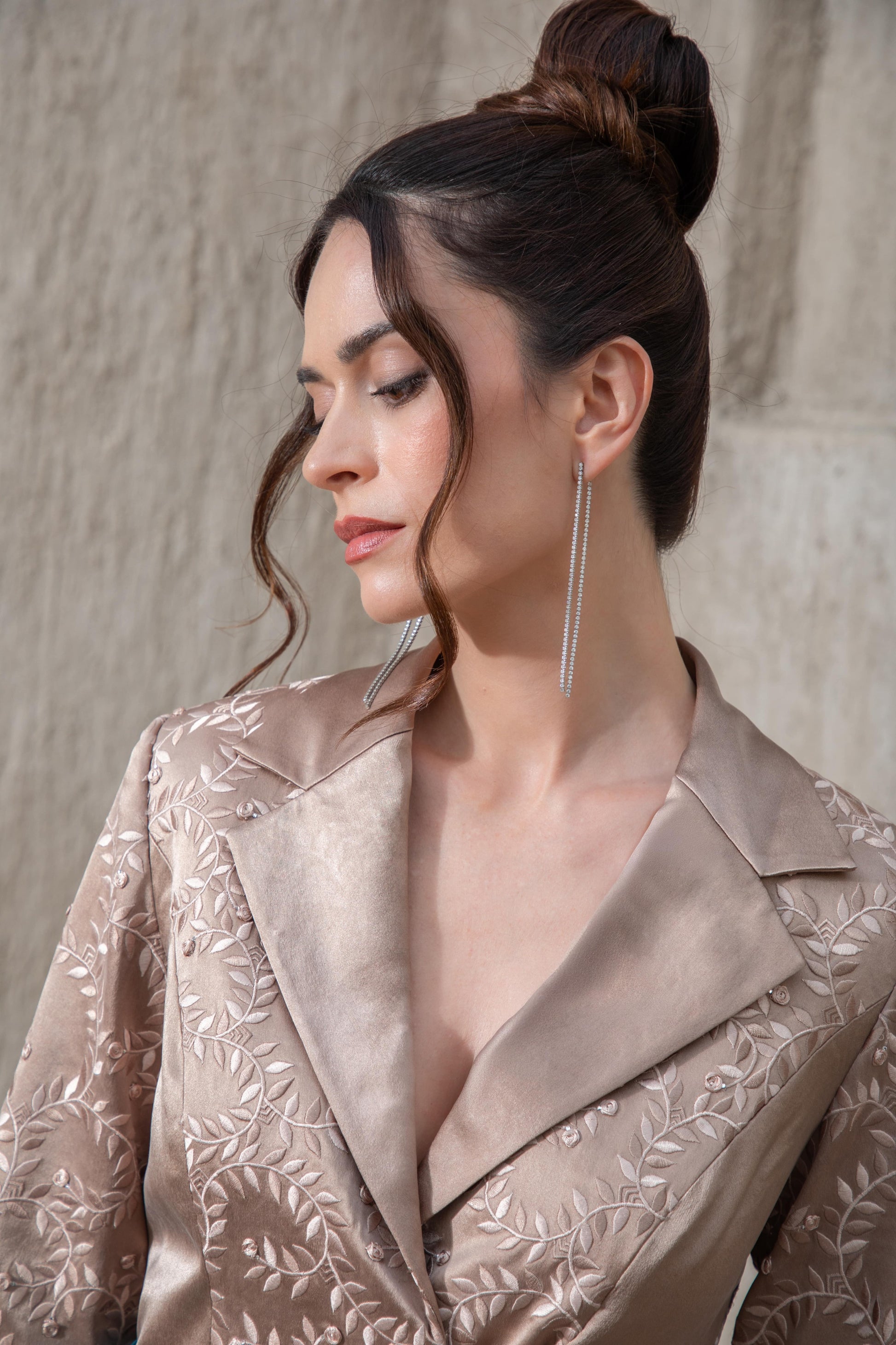 Close-up of brown embroidered top with lapel detailing