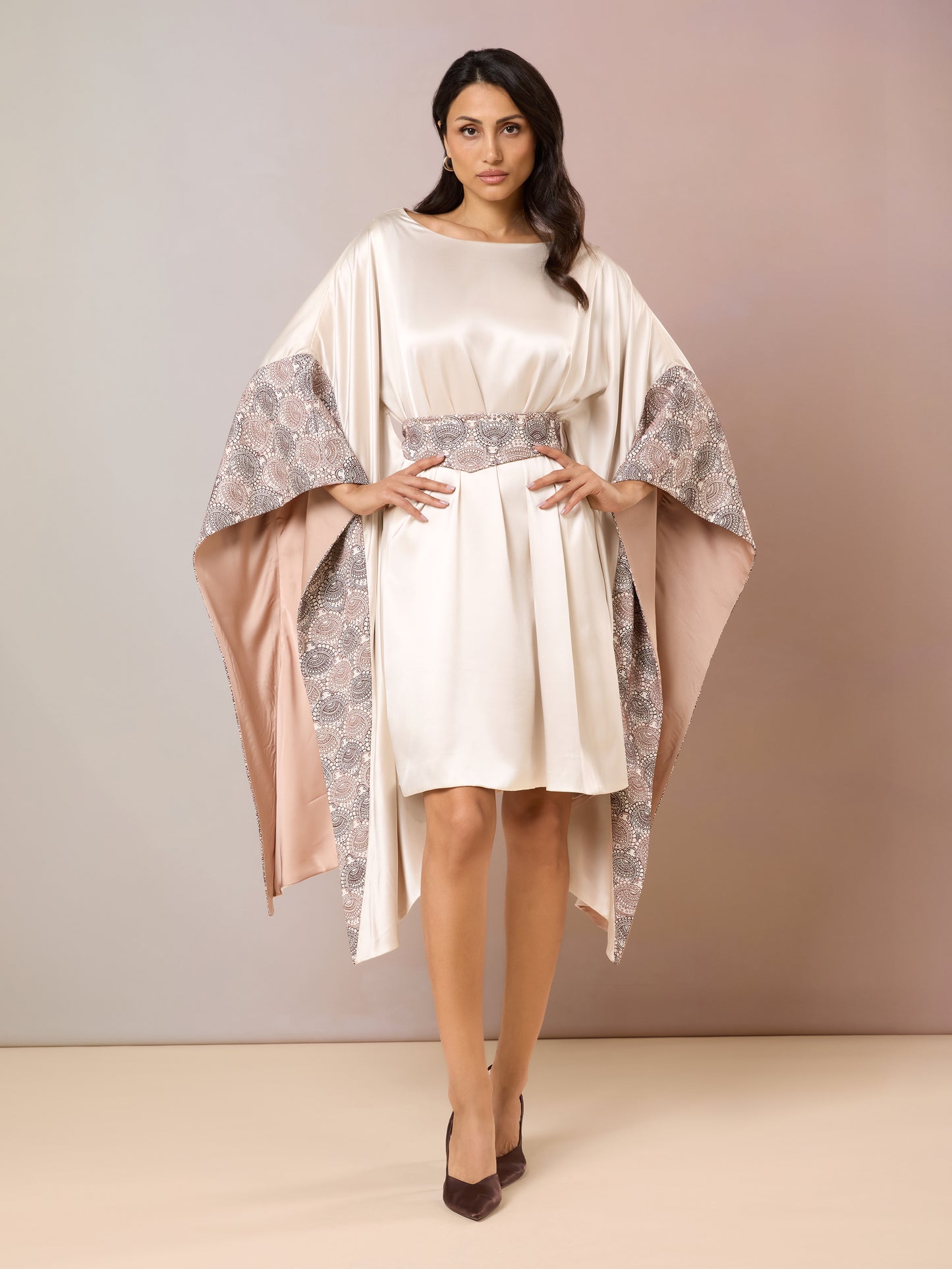 Model in Champagne Kaftan dress with flared sleeves