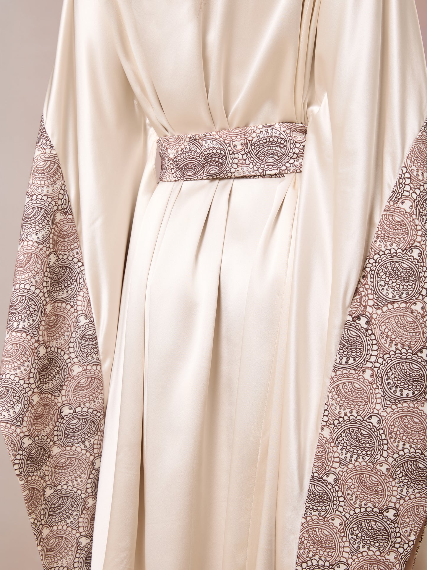 Close-up of cinched waist and floral embroidery on Champagne Kaftan