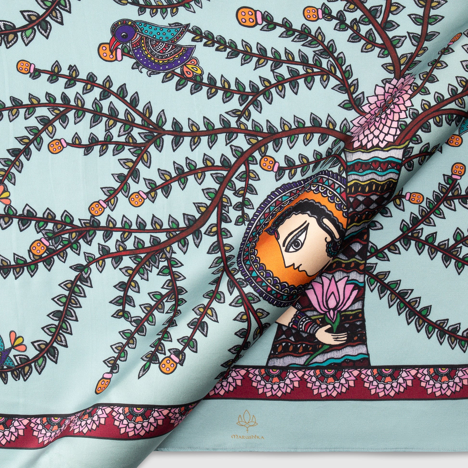 Close-up of Madhubani silk scarf showing detailed tree of life and traditional motifs