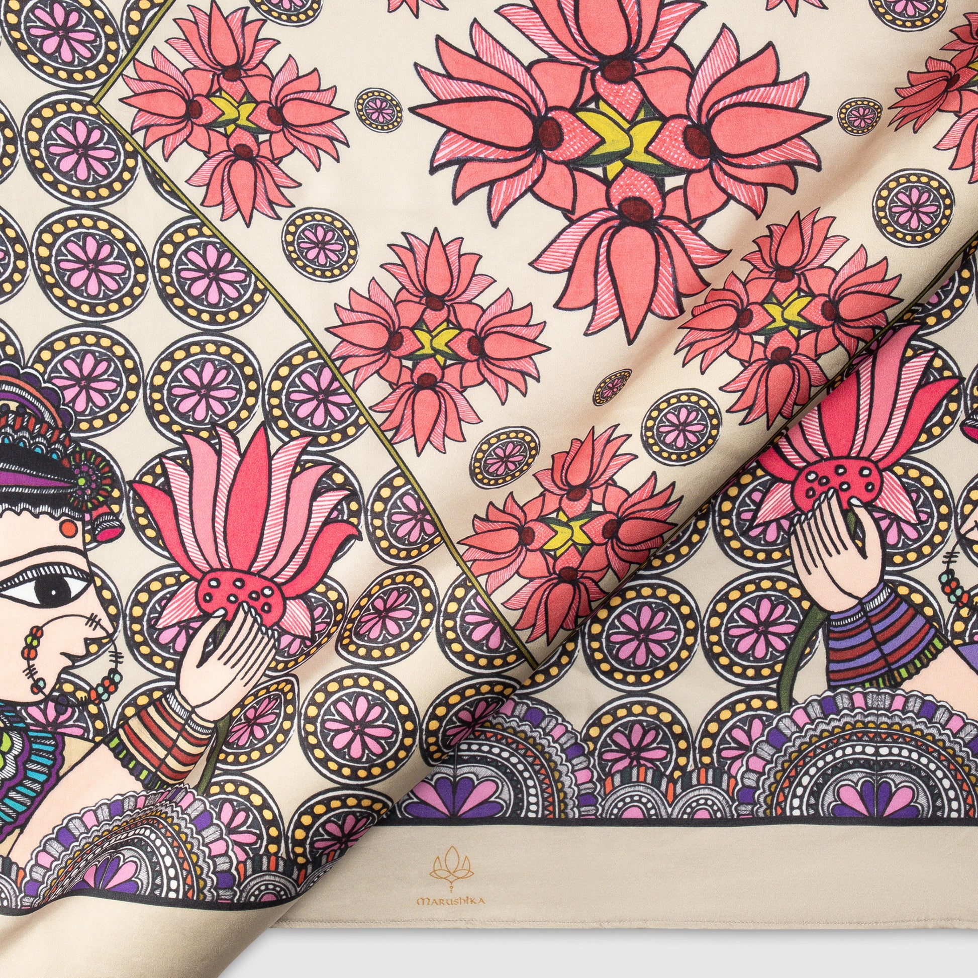 Close-up of Madhubani silk scarf featuring lotus flowers and feminine hand-painted details