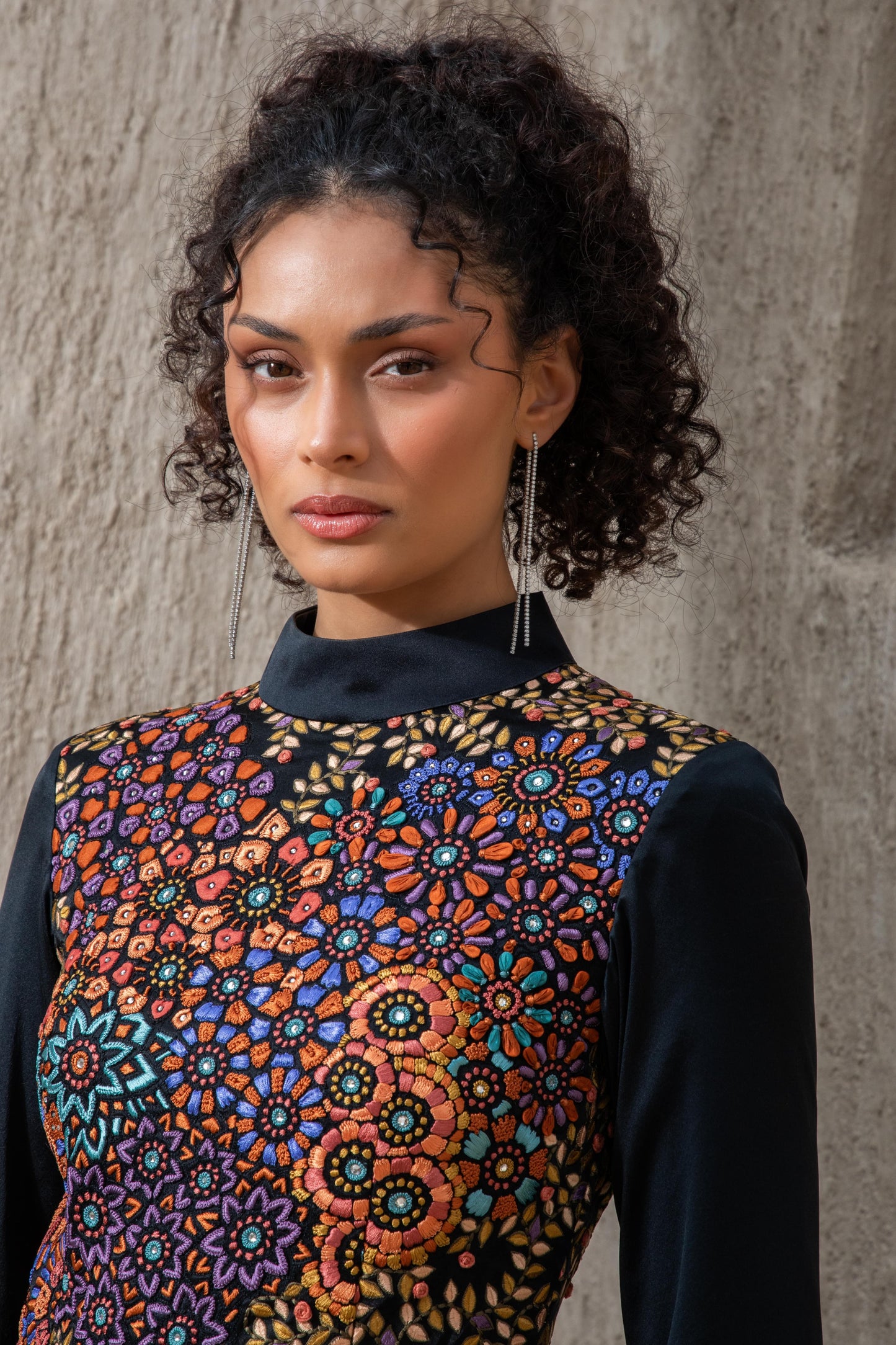 Close-up of embroidered bodice on black ice jumpsuit