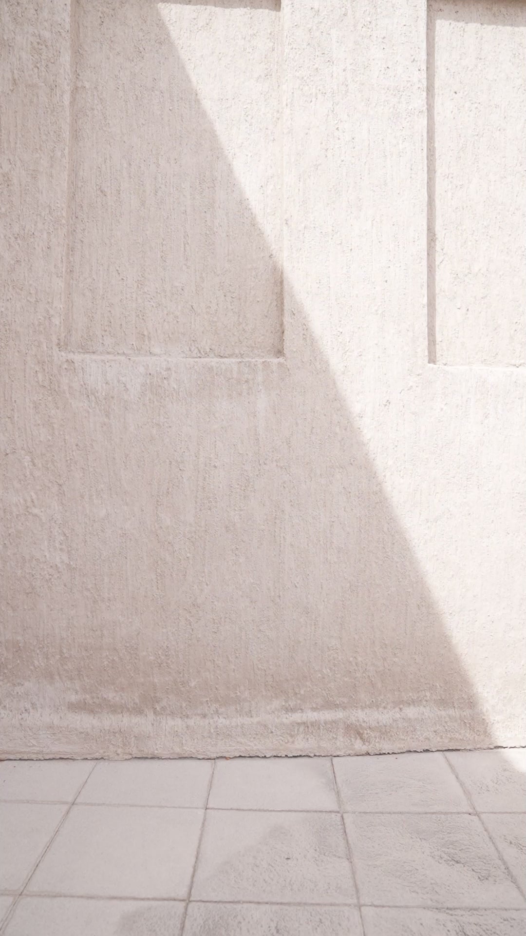 Model walking in black ice jumpsuit with cape for evening wear