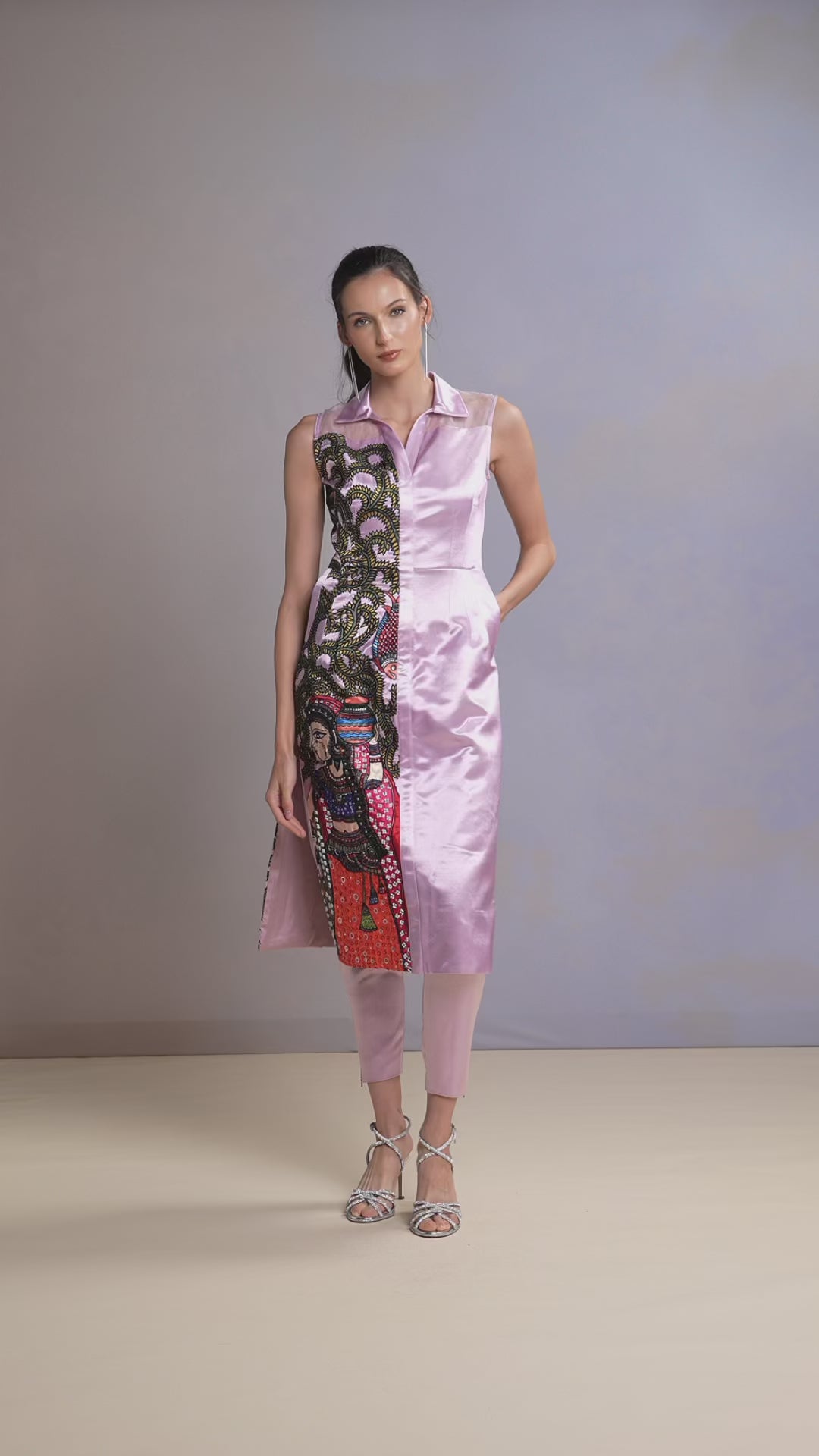 Model walking in embroidered French Lilac kurti and pastel trouser set