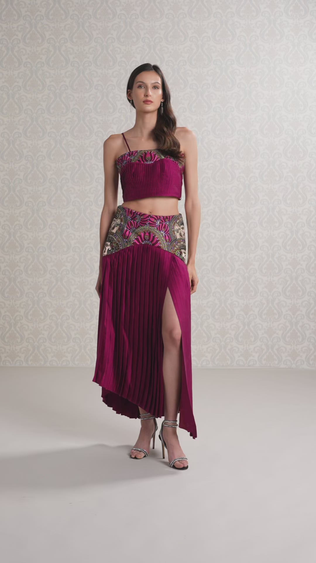 Model twirling in cranberry silk satin and vegan leather designer co-ord set