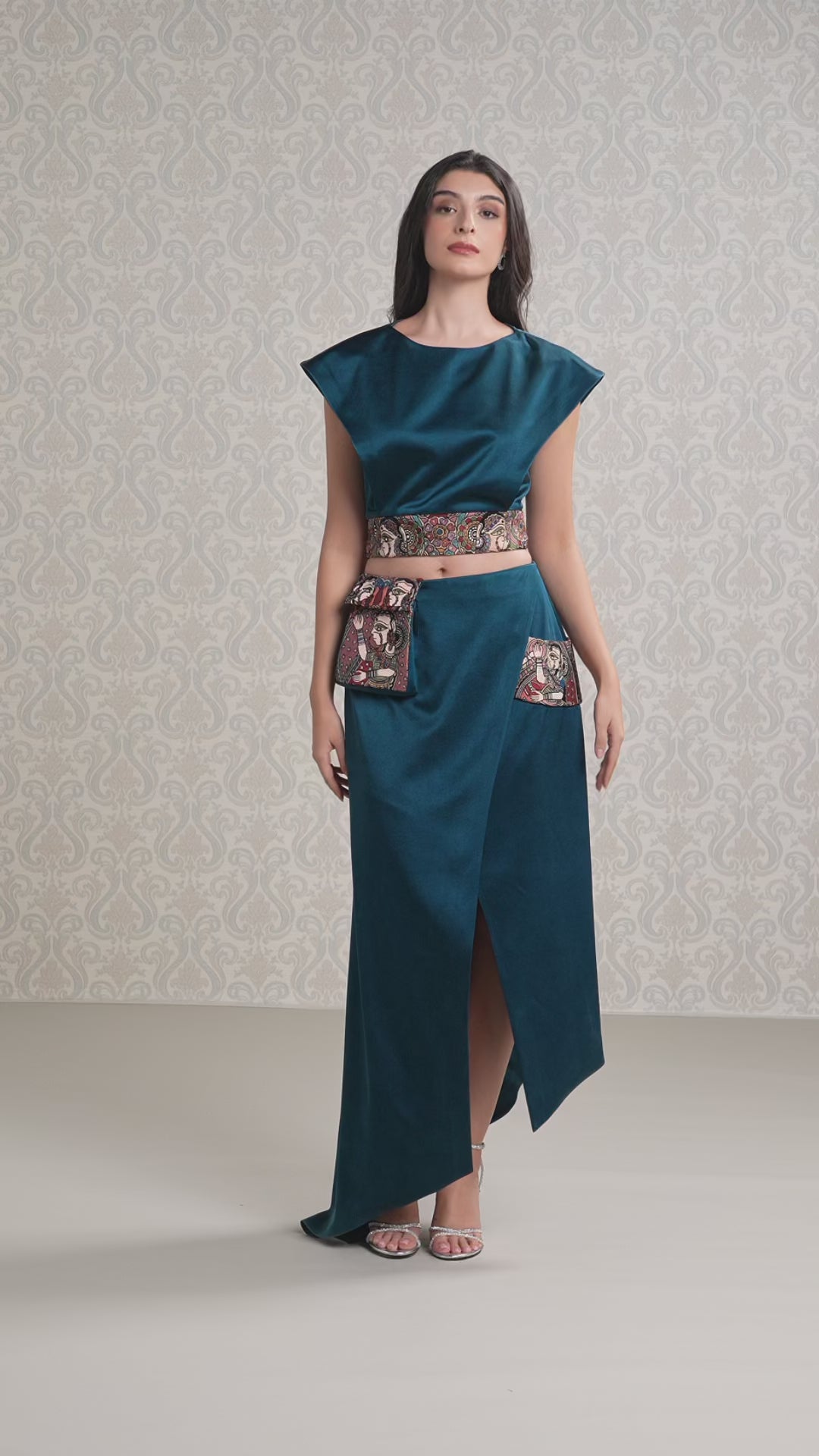 Model walking in moonlight blue satin and vegan leather designer set