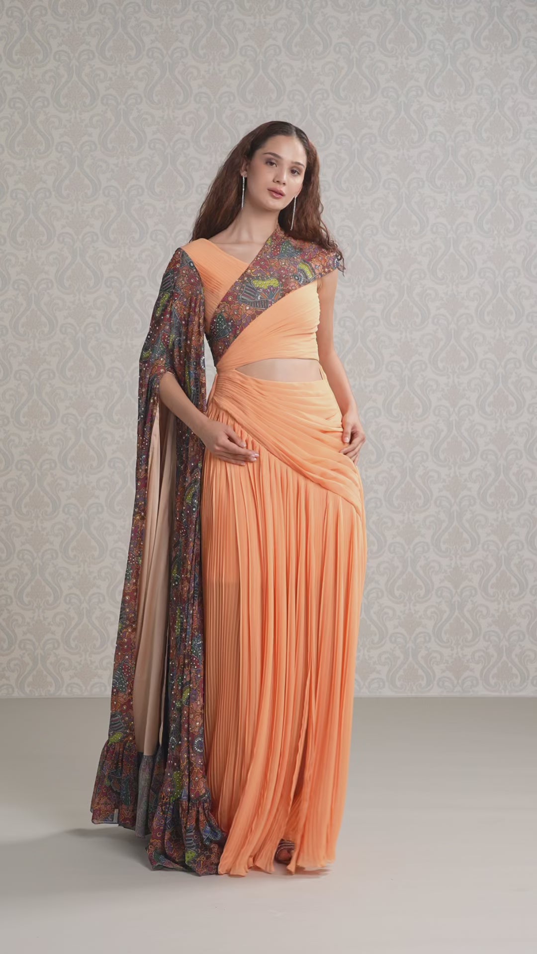 Model walking in pastel pumpkin georgette dress showcasing fluid drape and movement