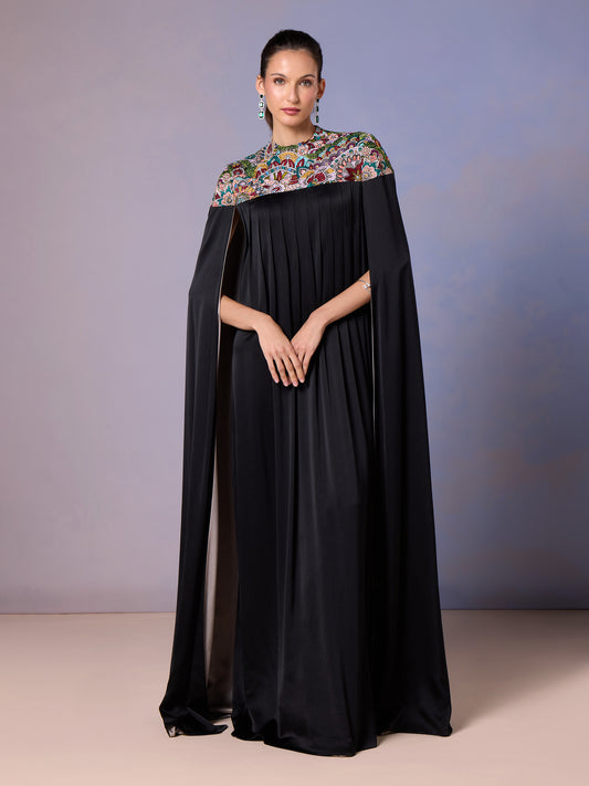 Model in Midnight Black silk kaftan with colorful embroidered yoke