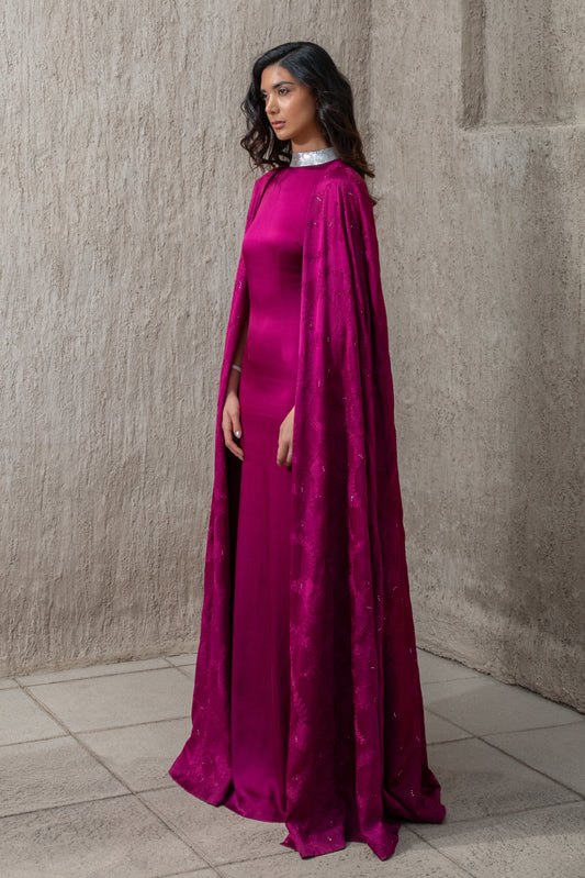 Side profile of model in elegant cranberry evening gown