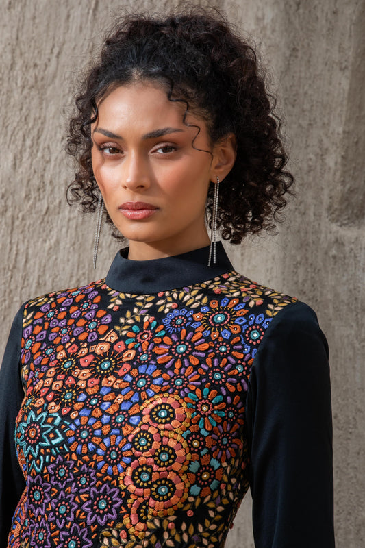 Close-up of embroidered bodice on black ice jumpsuit 