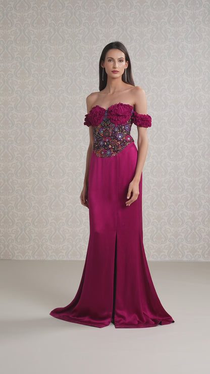 Model walking in cranberry silk satin georgette gown with elegant floral off-shoulder look